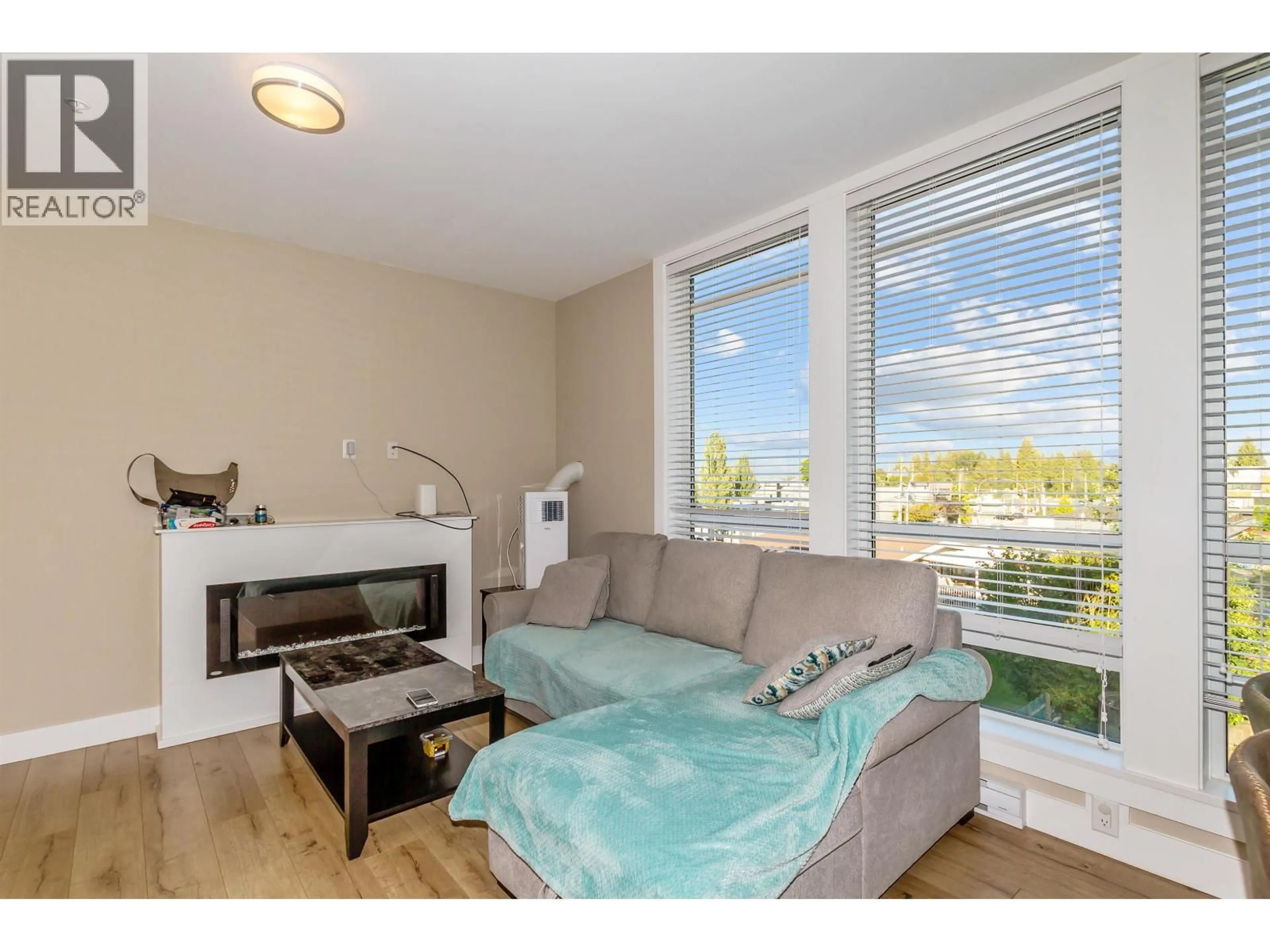 Living room with furniture, wood/laminate floor for 316 - 12460 191 STREET, Pitt Meadows British Columbia V3Y2J2