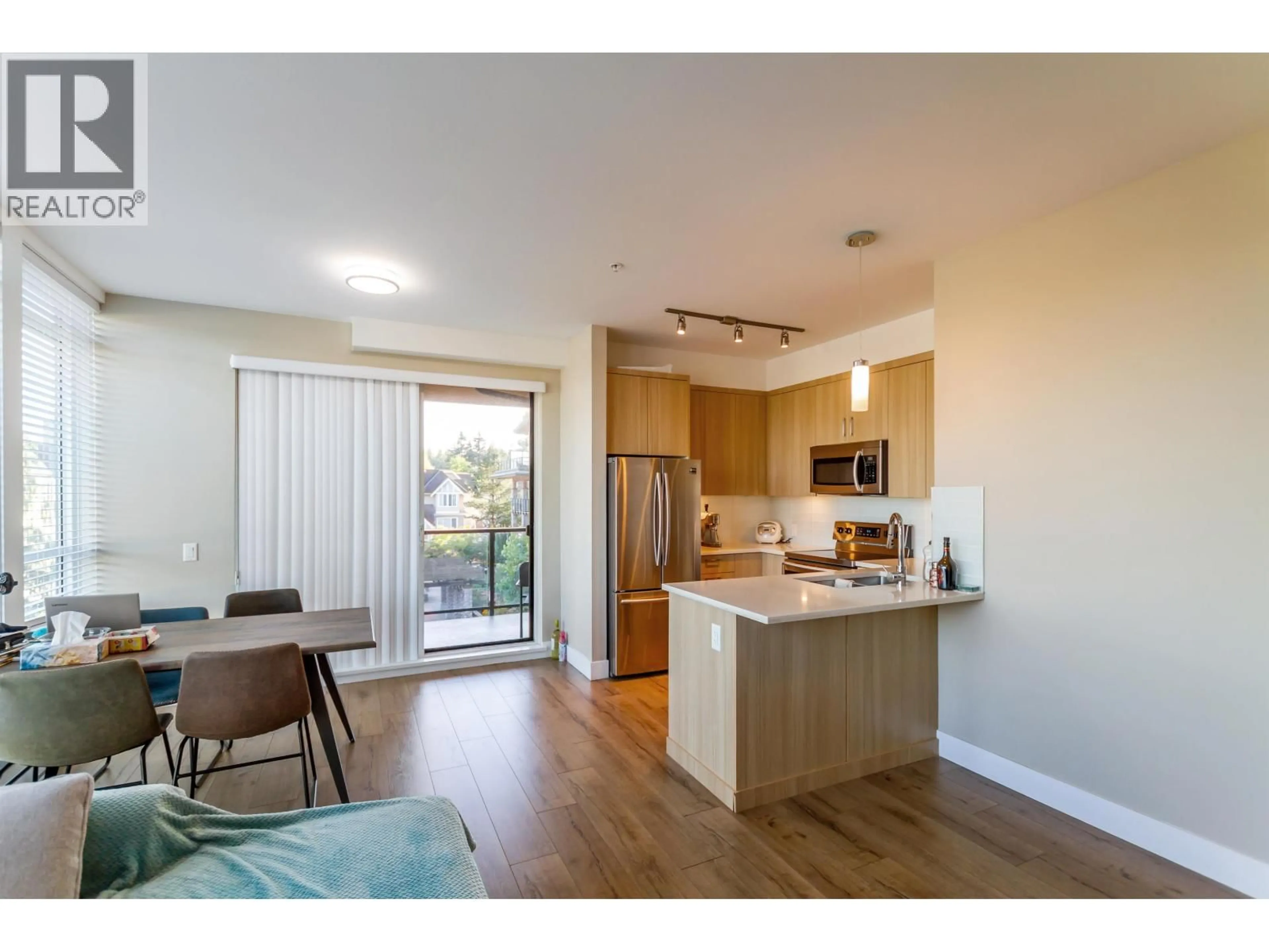 Open concept kitchen, wood/laminate floor for 316 - 12460 191 STREET, Pitt Meadows British Columbia V3Y2J2
