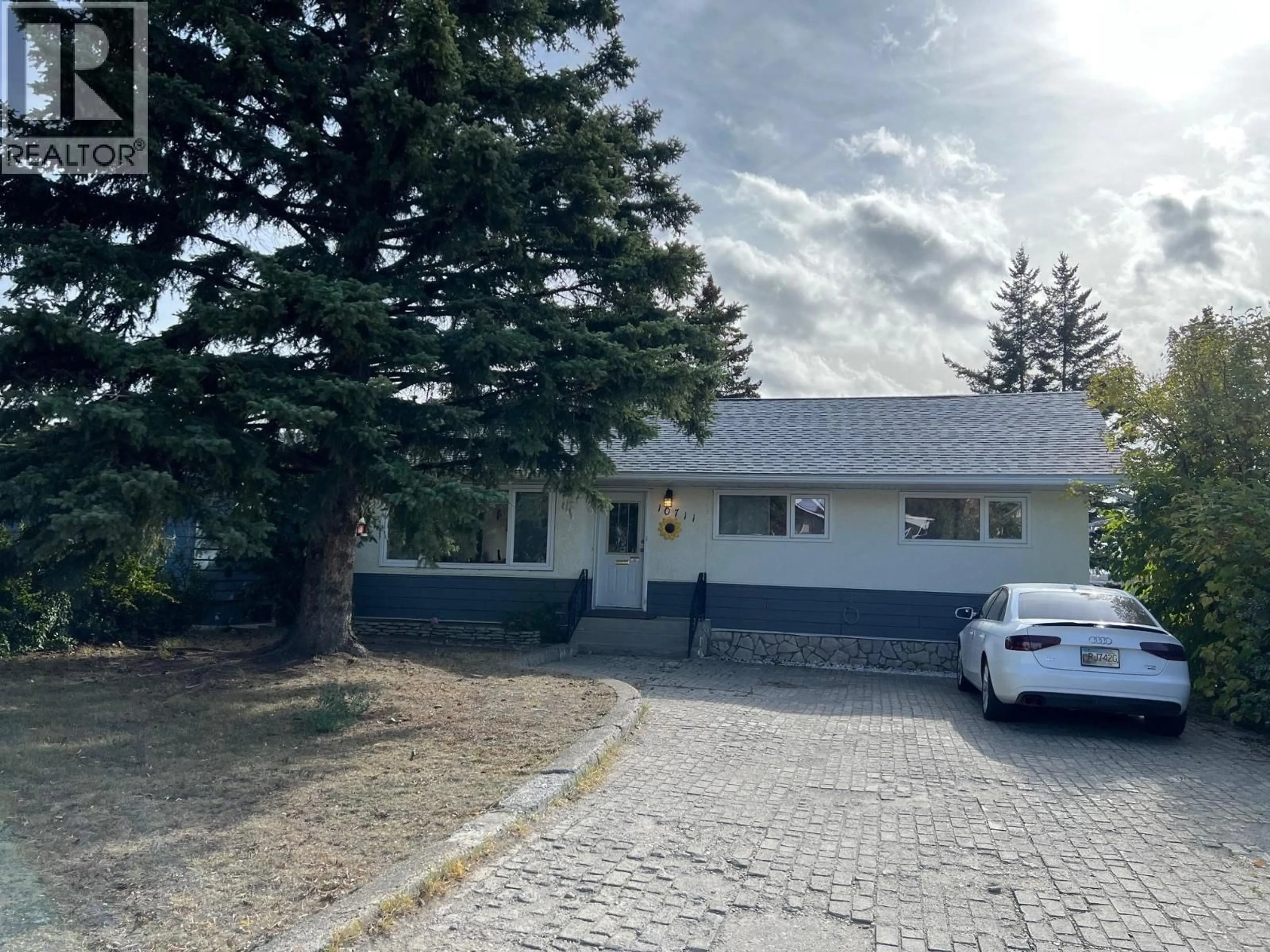A pic from outside/outdoor area/front of a property/back of a property/a pic from drone, street for 10711 103 AVENUE, Fort St. John British Columbia V1J2J2