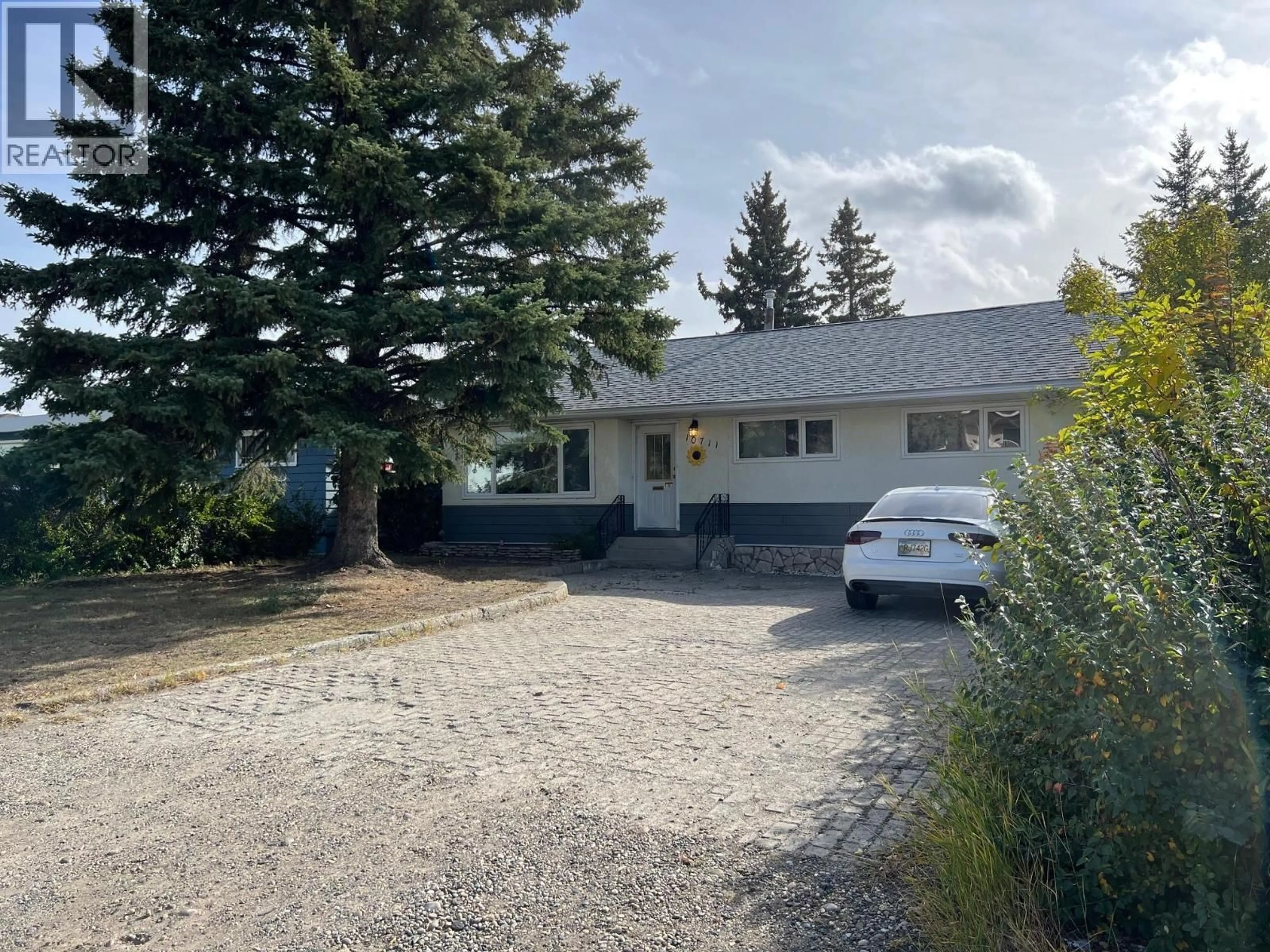 A pic from outside/outdoor area/front of a property/back of a property/a pic from drone, street for 10711 103 AVENUE, Fort St. John British Columbia V1J2J2
