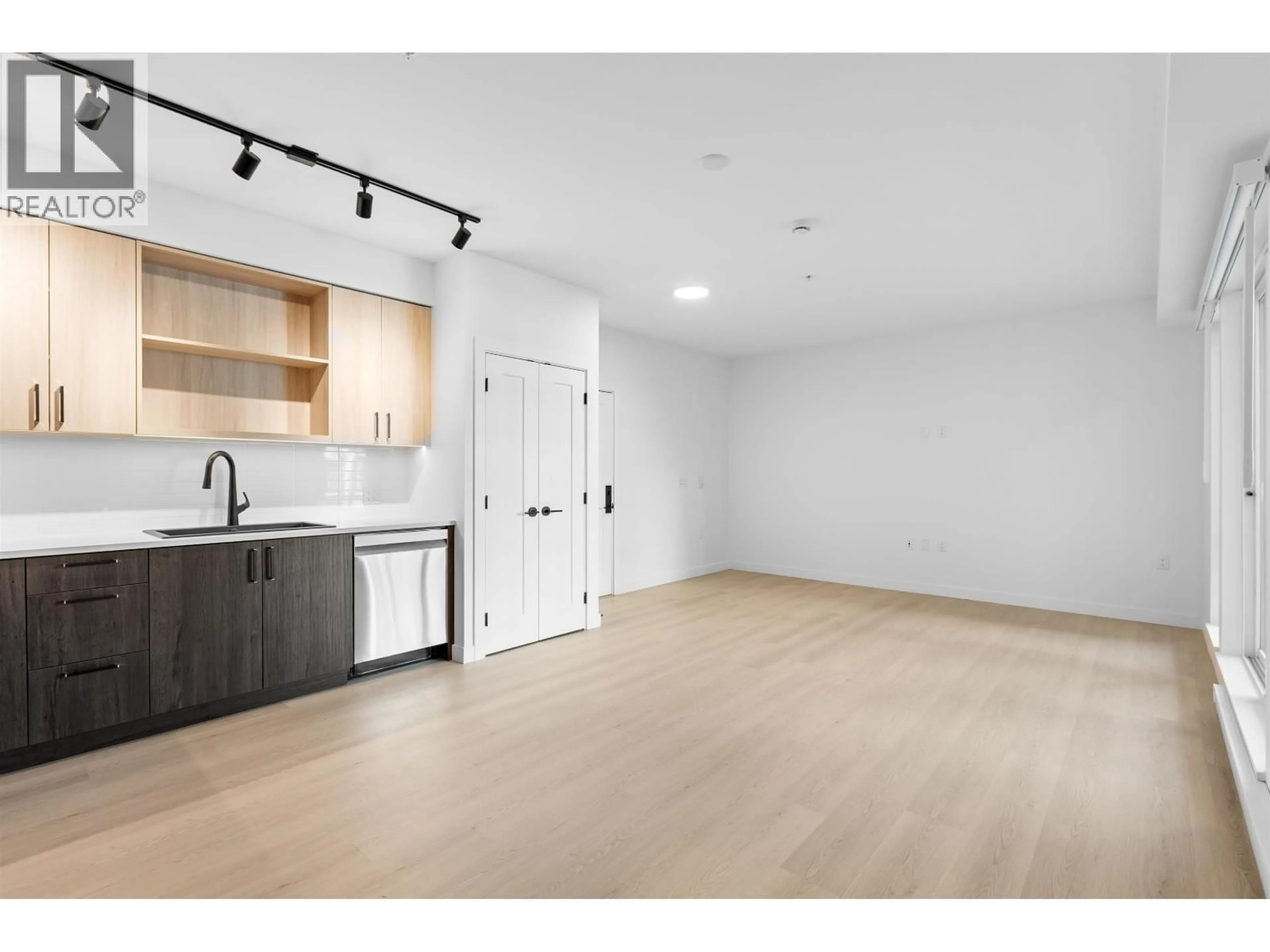 Open concept kitchen, wood/laminate floor for 221 - 2002 ST. GEORGE STREET, Port Moody British Columbia V3H2E6