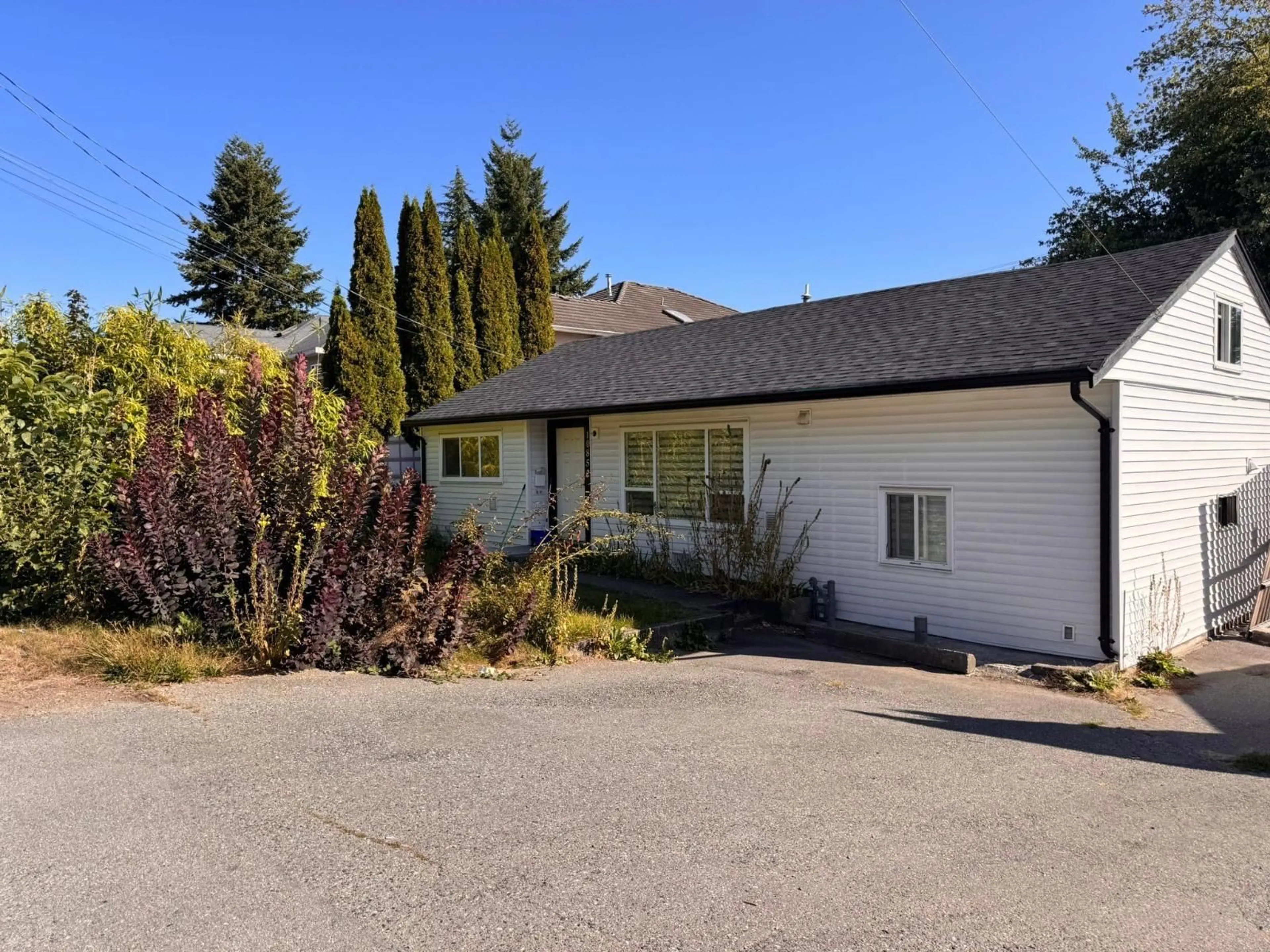 Home with vinyl exterior material, street for 10852 140, Surrey British Columbia V3R3G2