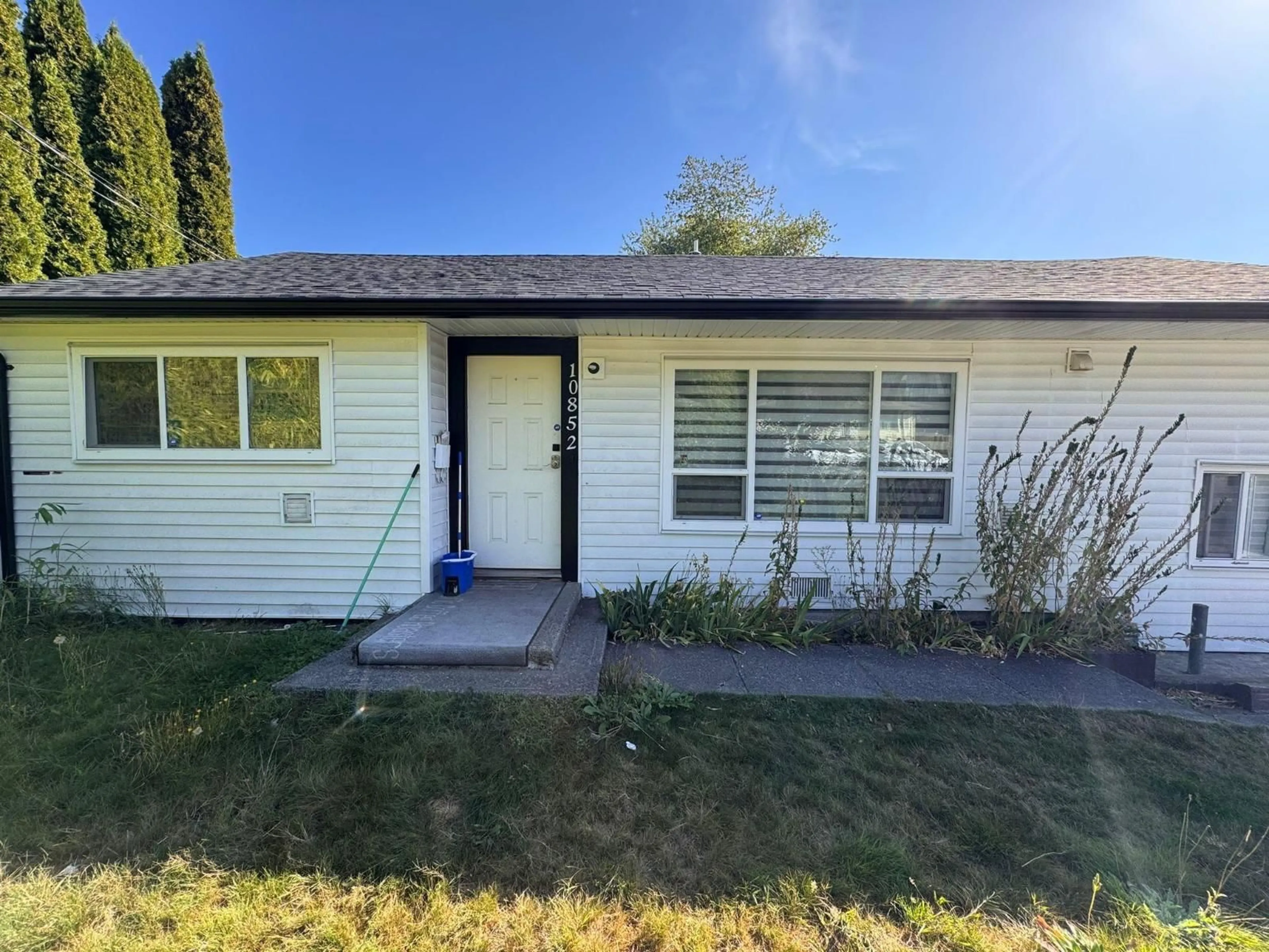 Home with vinyl exterior material, street for 10852 140, Surrey British Columbia V3R3G2