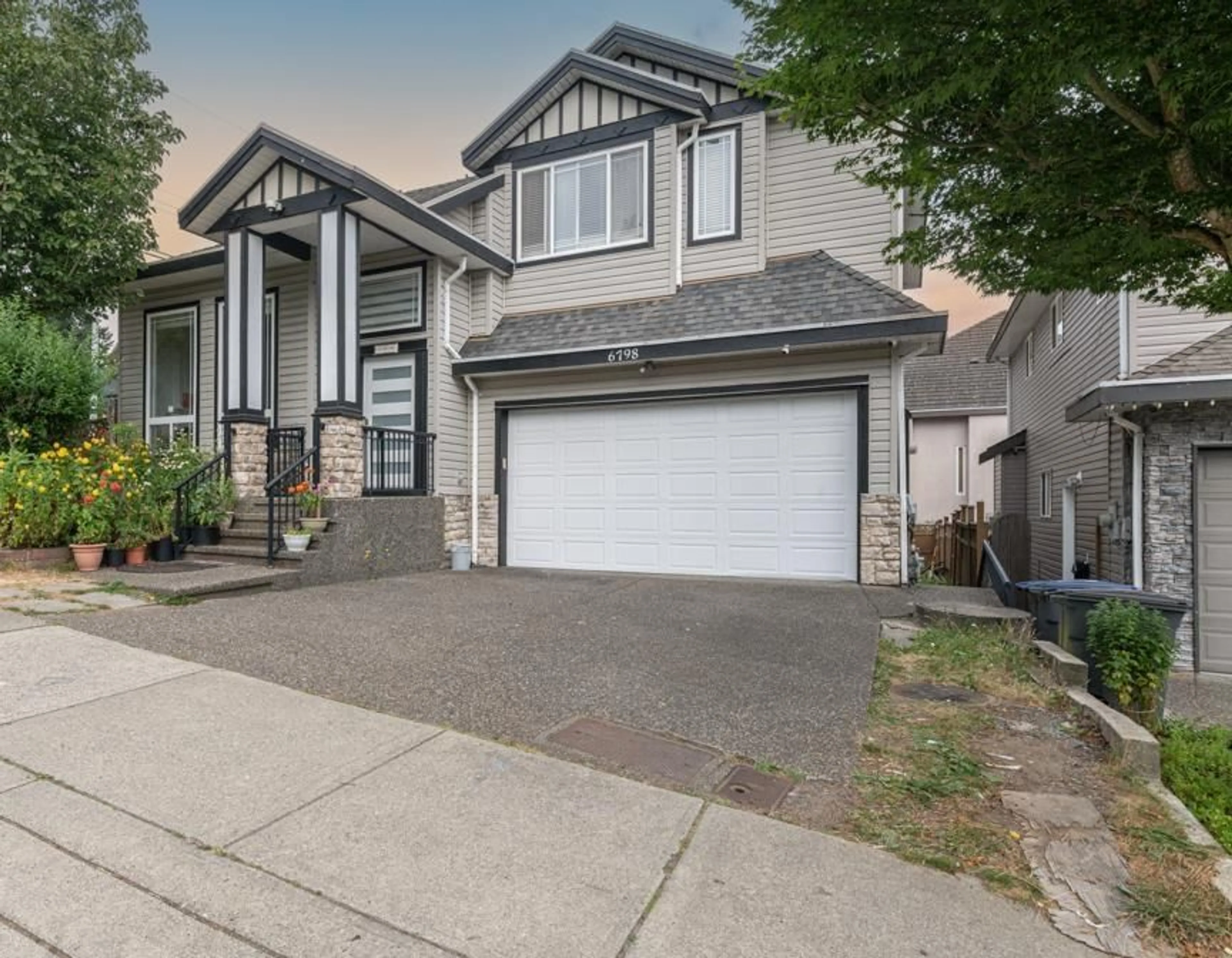 Home with vinyl exterior material, street for 6798 146B, Surrey British Columbia V3S0Z4