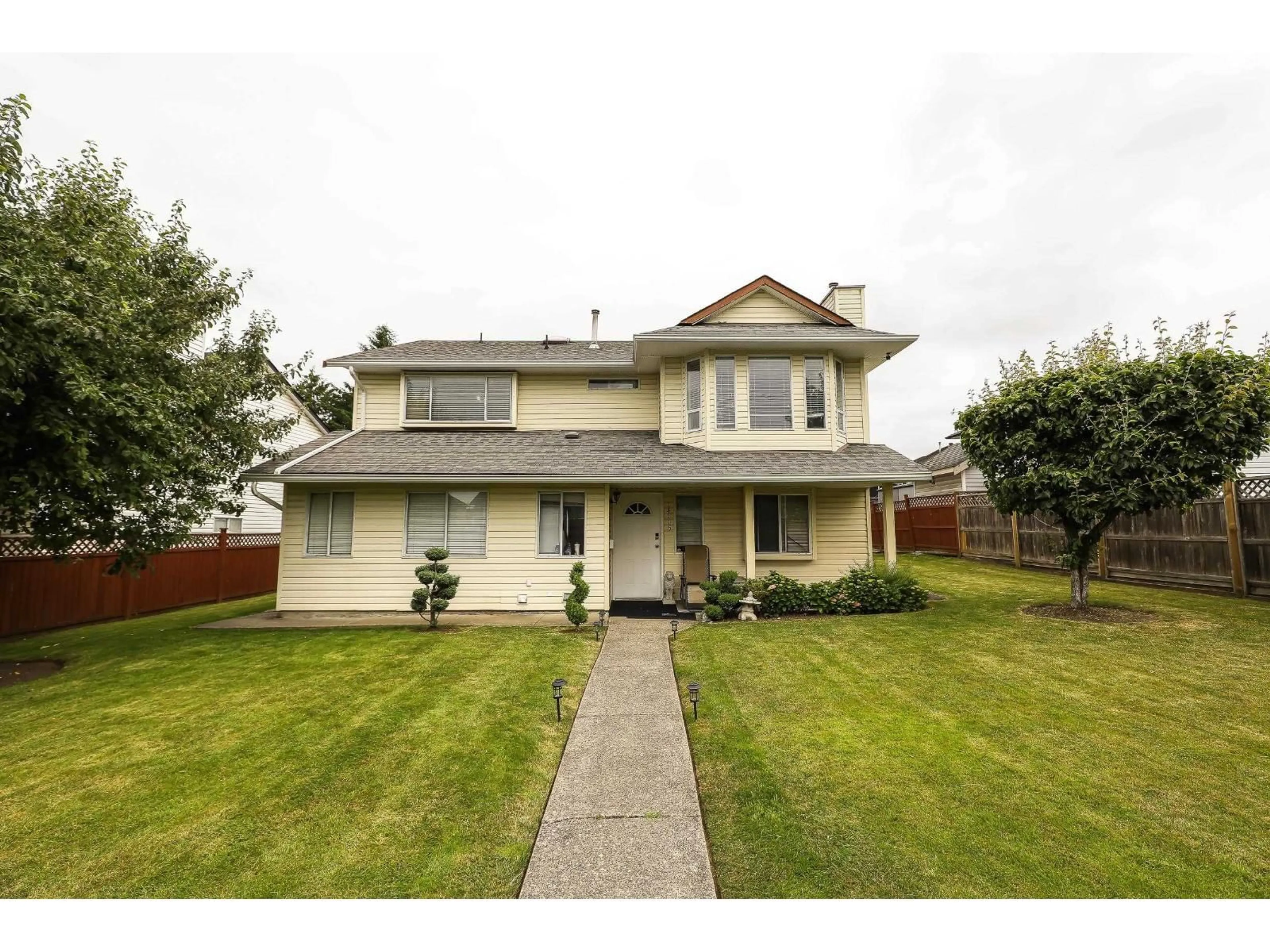 Home with vinyl exterior material, street for 14115 88TH, Surrey British Columbia V3W3L5