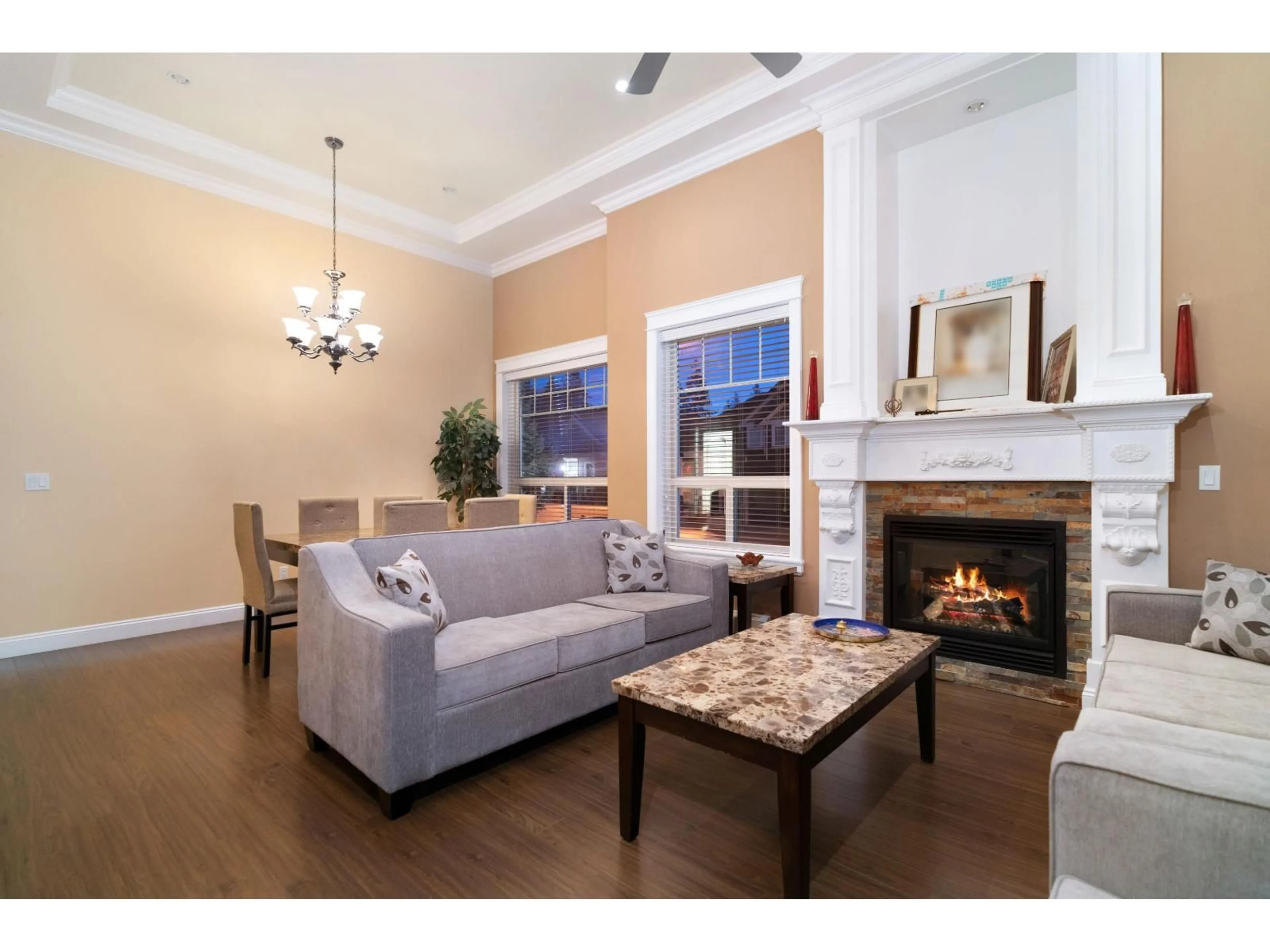 Living room with furniture, wood/laminate floor for 5878 129, Surrey British Columbia V3X0C7