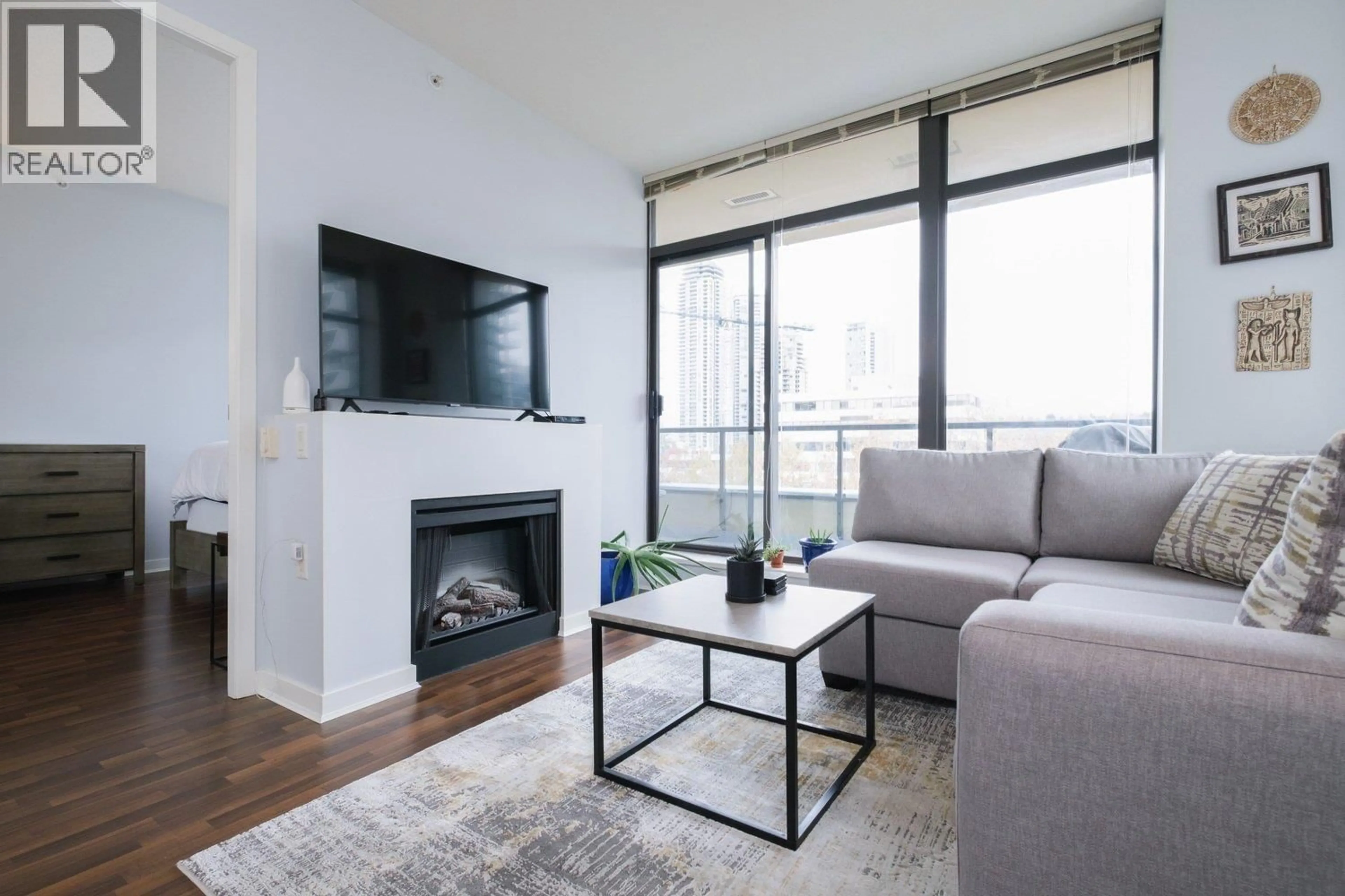 Living room with furniture, wood/laminate floor for 702 - 4250 DAWSON STREET, Burnaby British Columbia V5C4B1