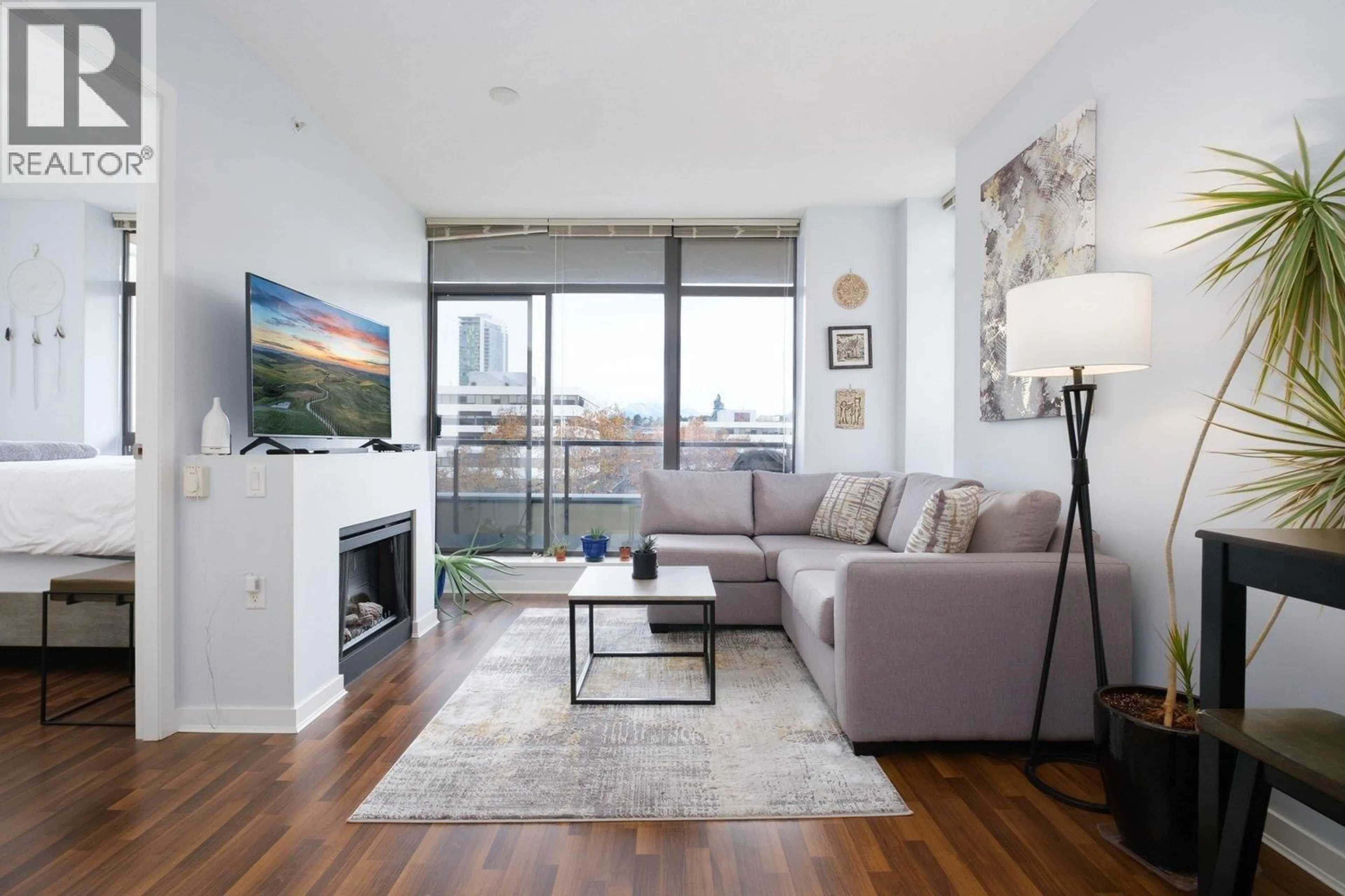 Living room with furniture, wood/laminate floor for 702 - 4250 DAWSON STREET, Burnaby British Columbia V5C4B1
