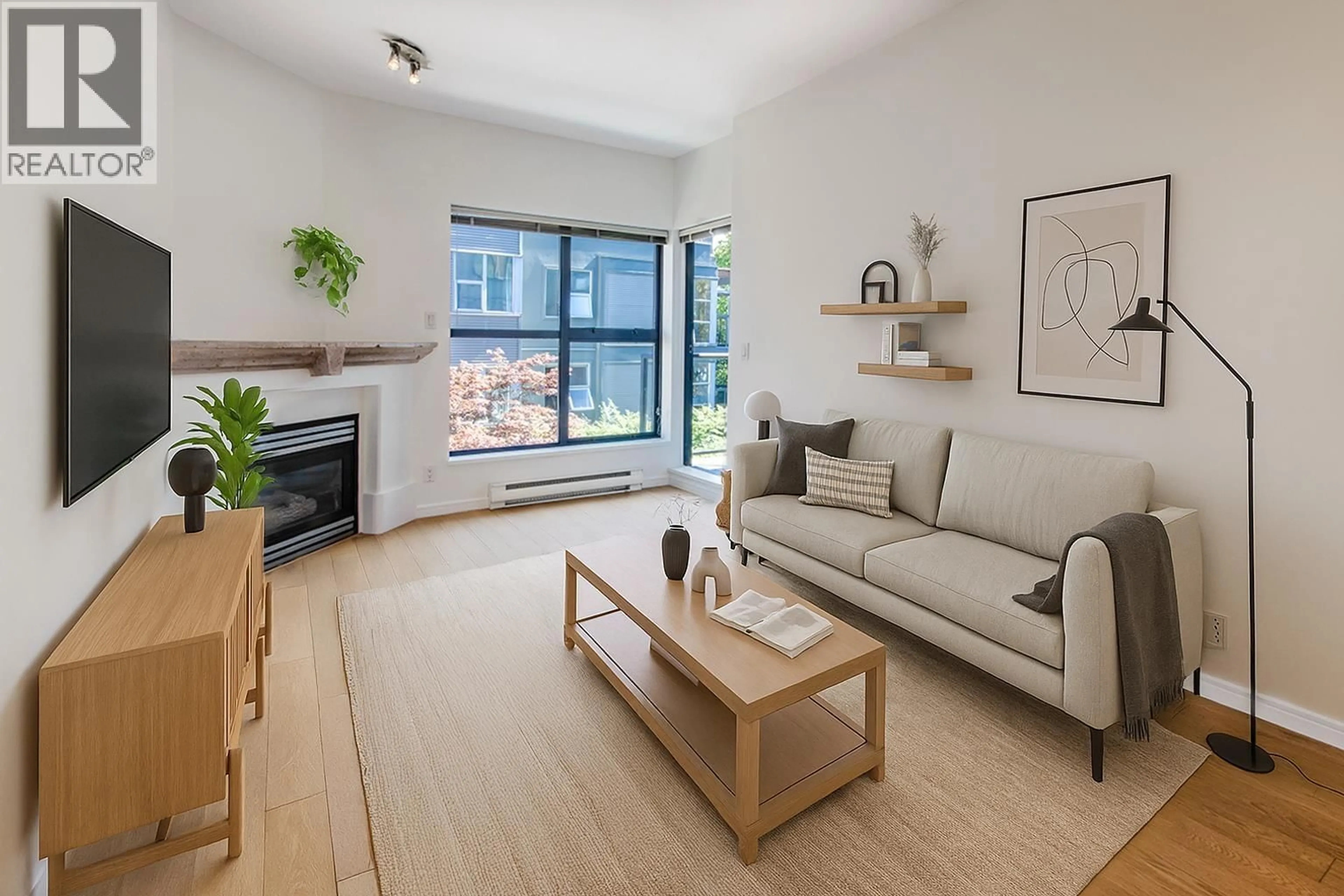 Living room with furniture, wood/laminate floor for 305 - 2688 VINE STREET, Vancouver British Columbia V6K4T6
