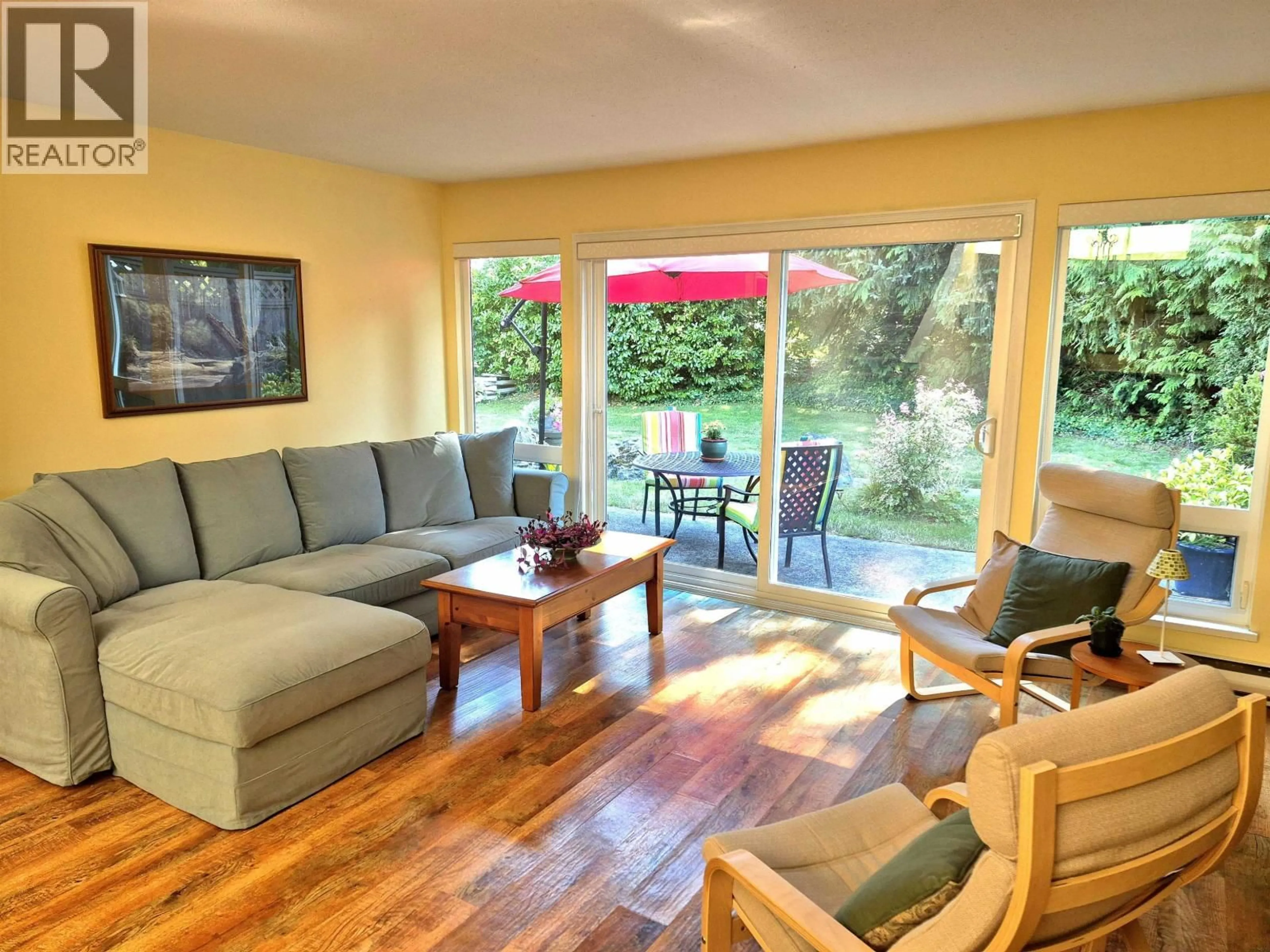 Living room with furniture, wood/laminate floor for 12 - 5761 WHARF AVENUE, Sechelt British Columbia V0N3A0