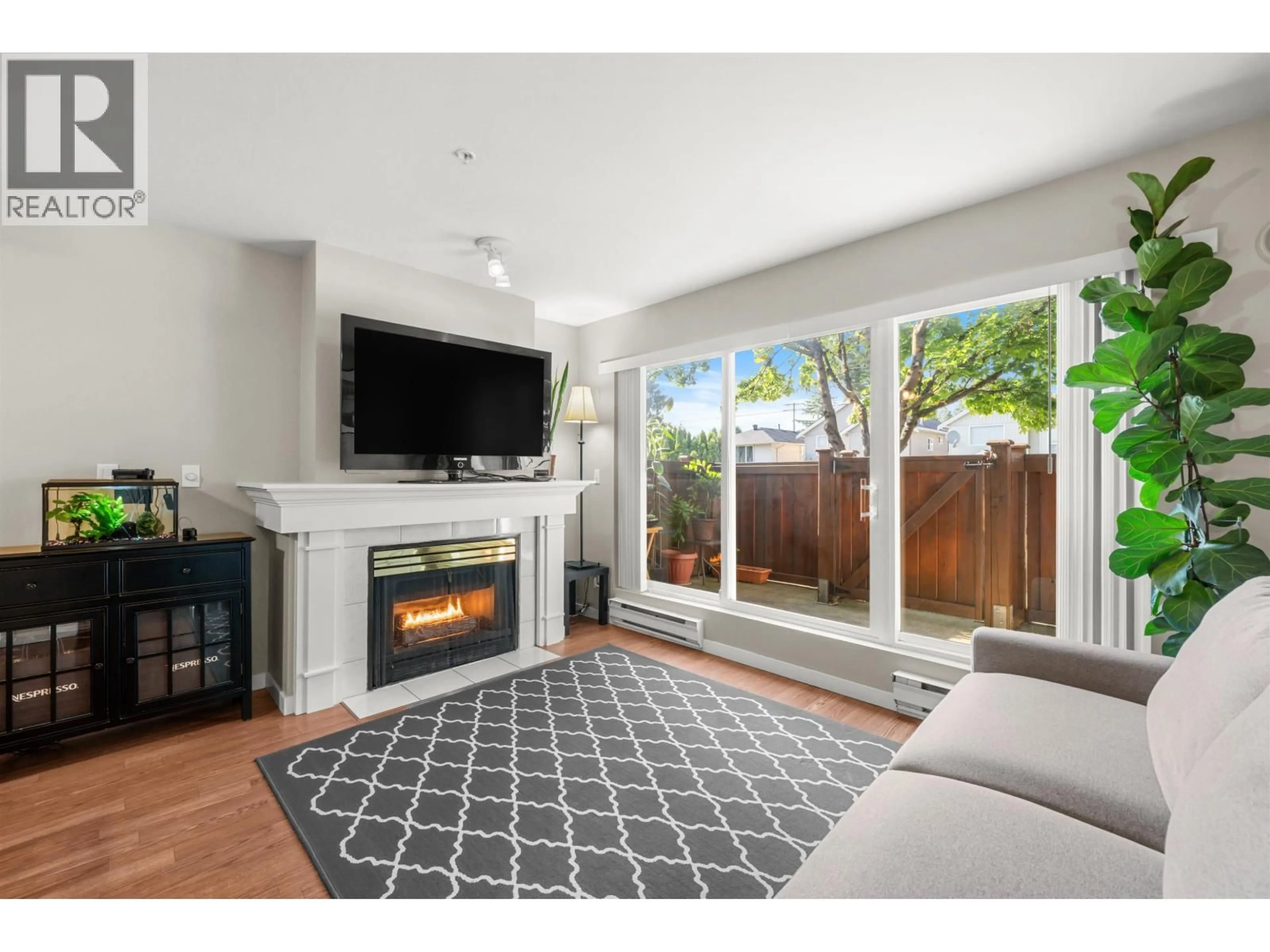 Living room with furniture, unknown for 102 - 1570 PRAIRIE AVENUE, Port Coquitlam British Columbia V3B1T4