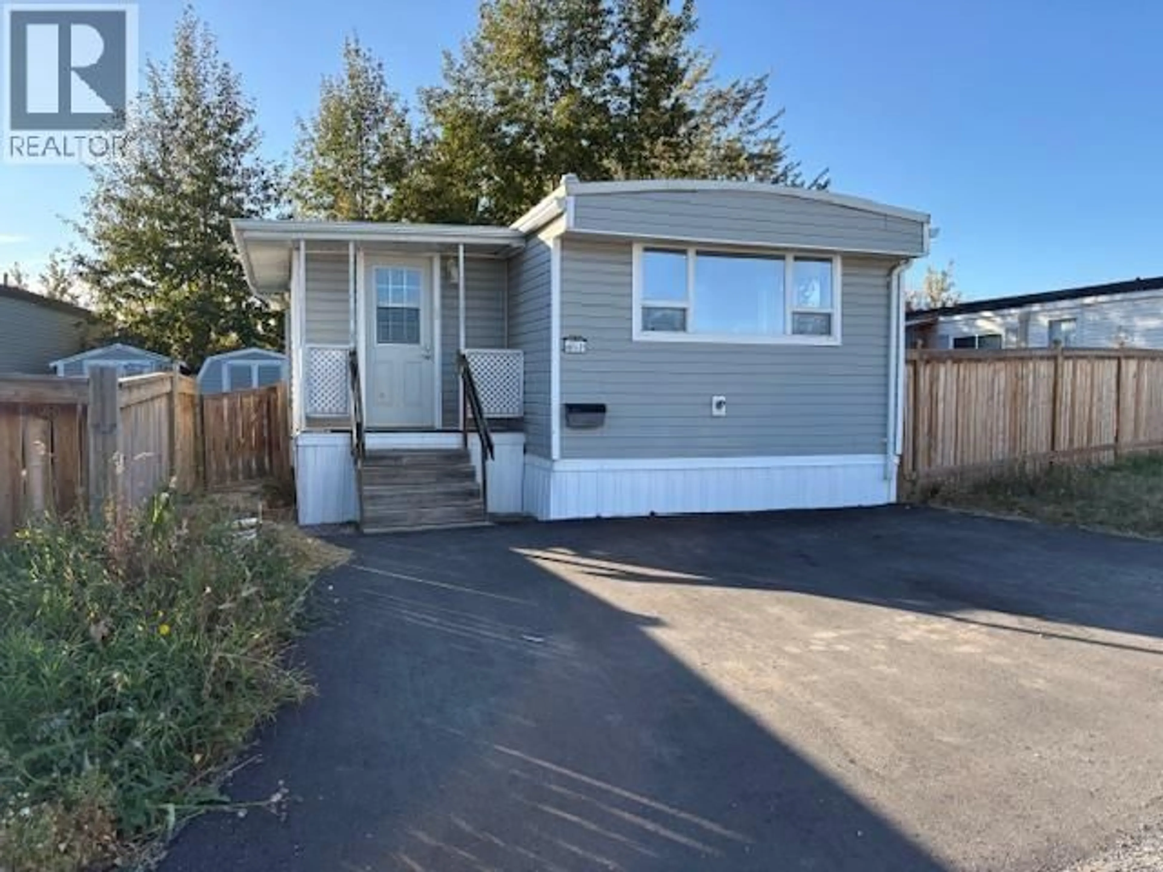 Home with vinyl exterior material, street for 61 - 8420 ALASKA HIGHWAY, Fort St. John British Columbia V1J4J6