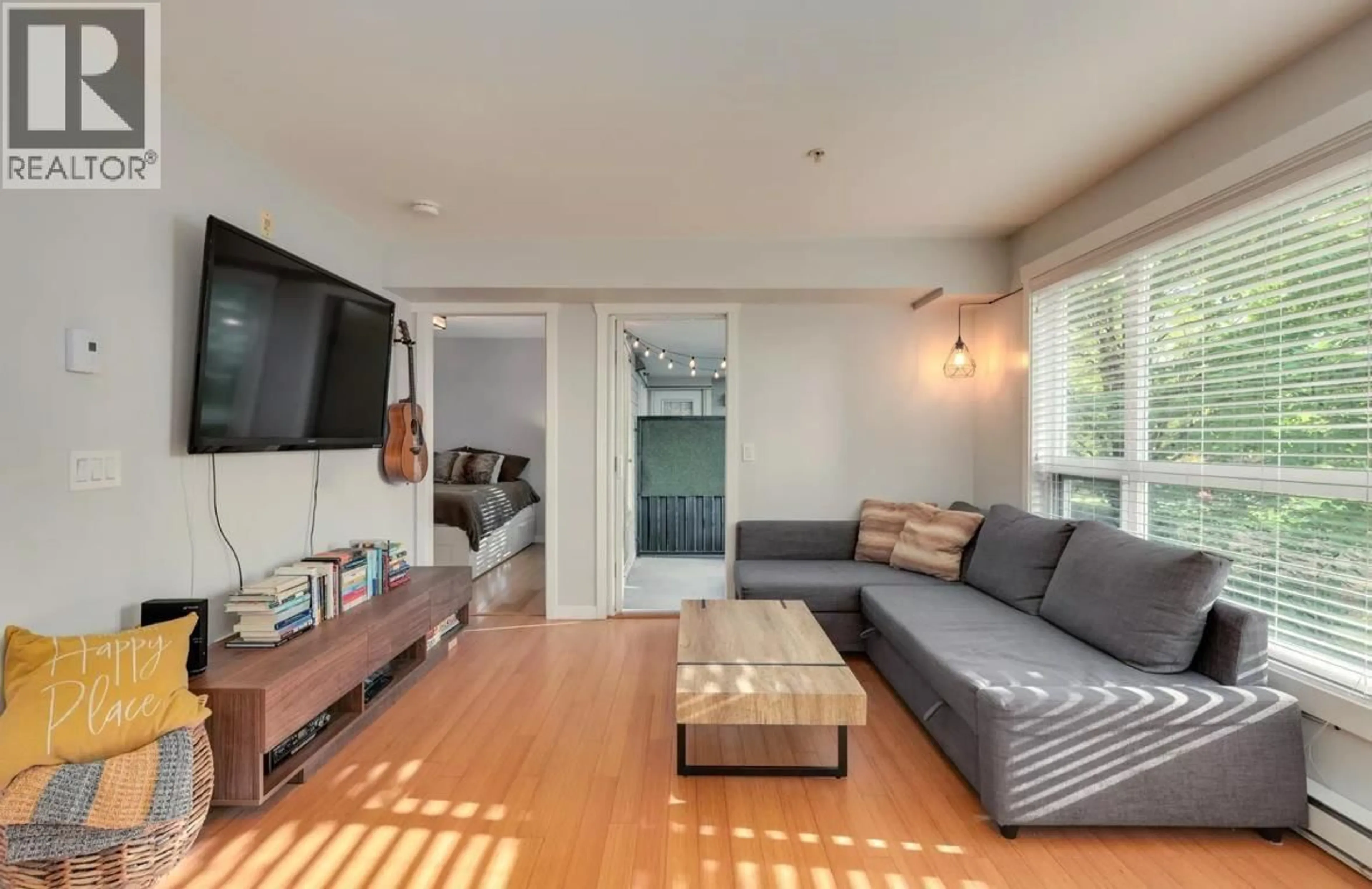 Living room with furniture, wood/laminate floor for 212 - 3575 EUCLID AVENUE, Vancouver British Columbia V5R6H5