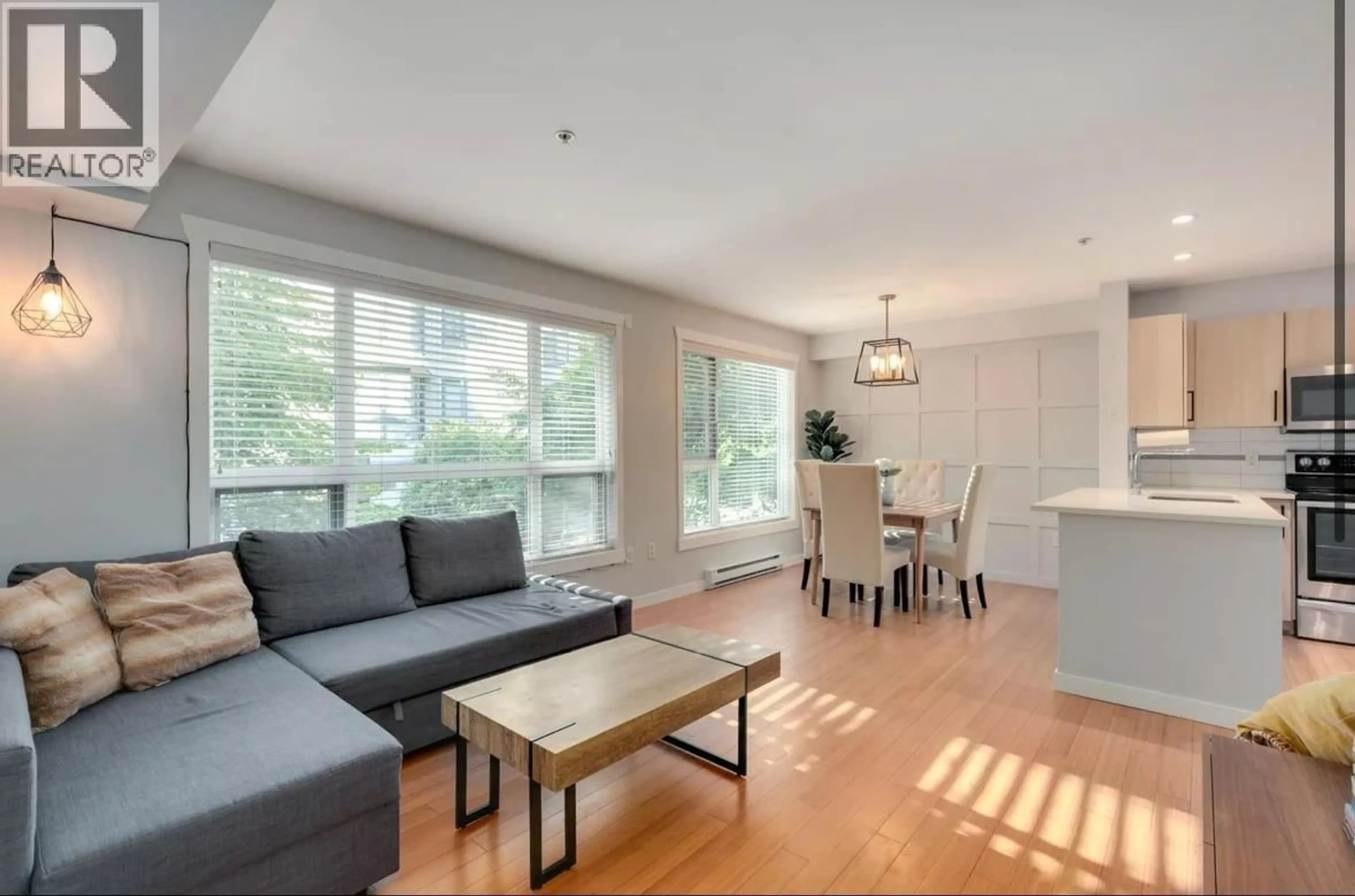 Living room with furniture, wood/laminate floor for 212 - 3575 EUCLID AVENUE, Vancouver British Columbia V5R6H5