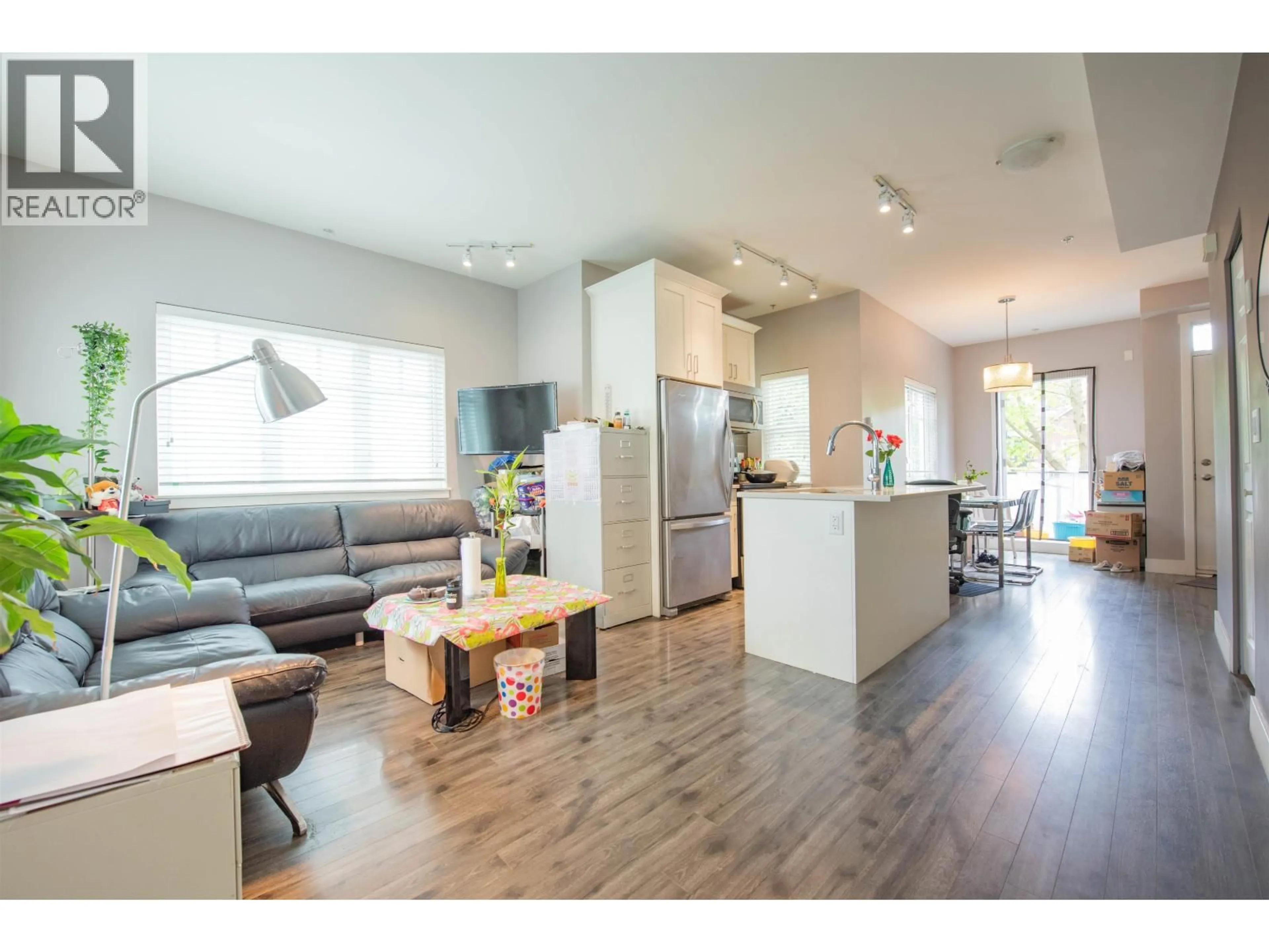 Open concept kitchen, wood/laminate floor for 207 - 2263 TRIUMPH STREET, Vancouver British Columbia V5L1L2