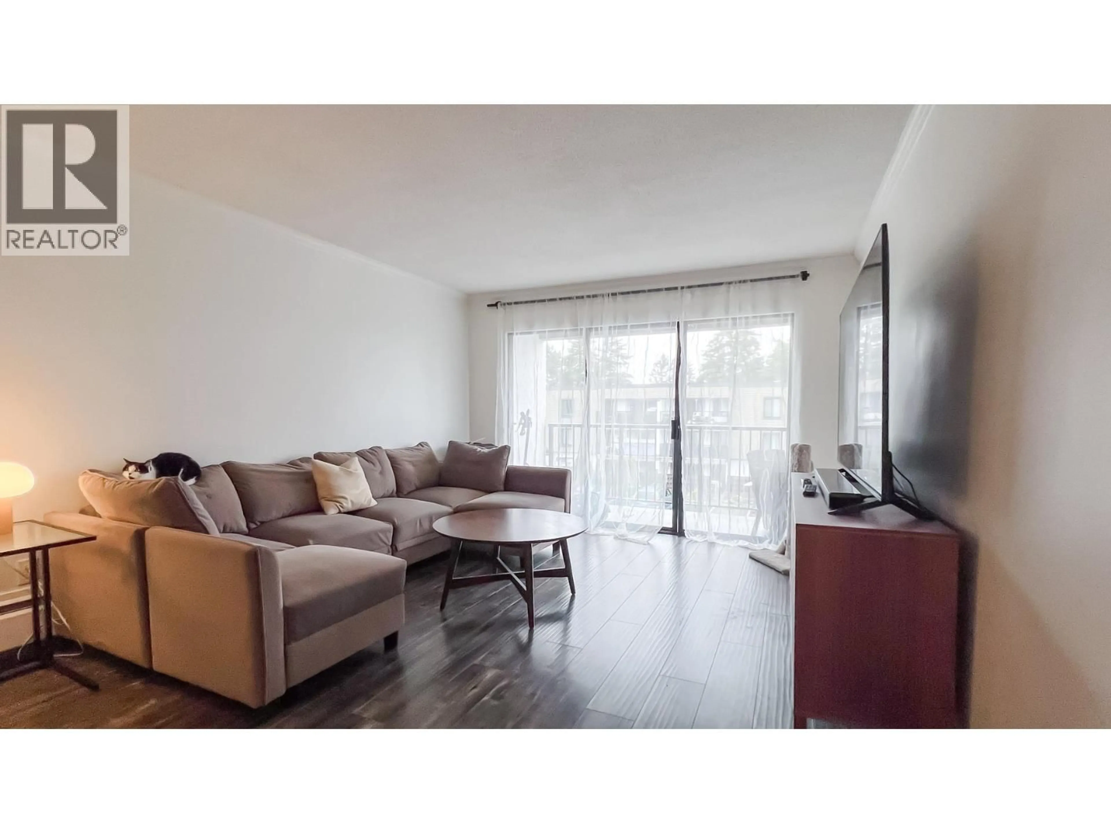 Living room with furniture, wood/laminate floor for 225 - 8860 NO. 1 ROAD, Richmond British Columbia V7C4C2