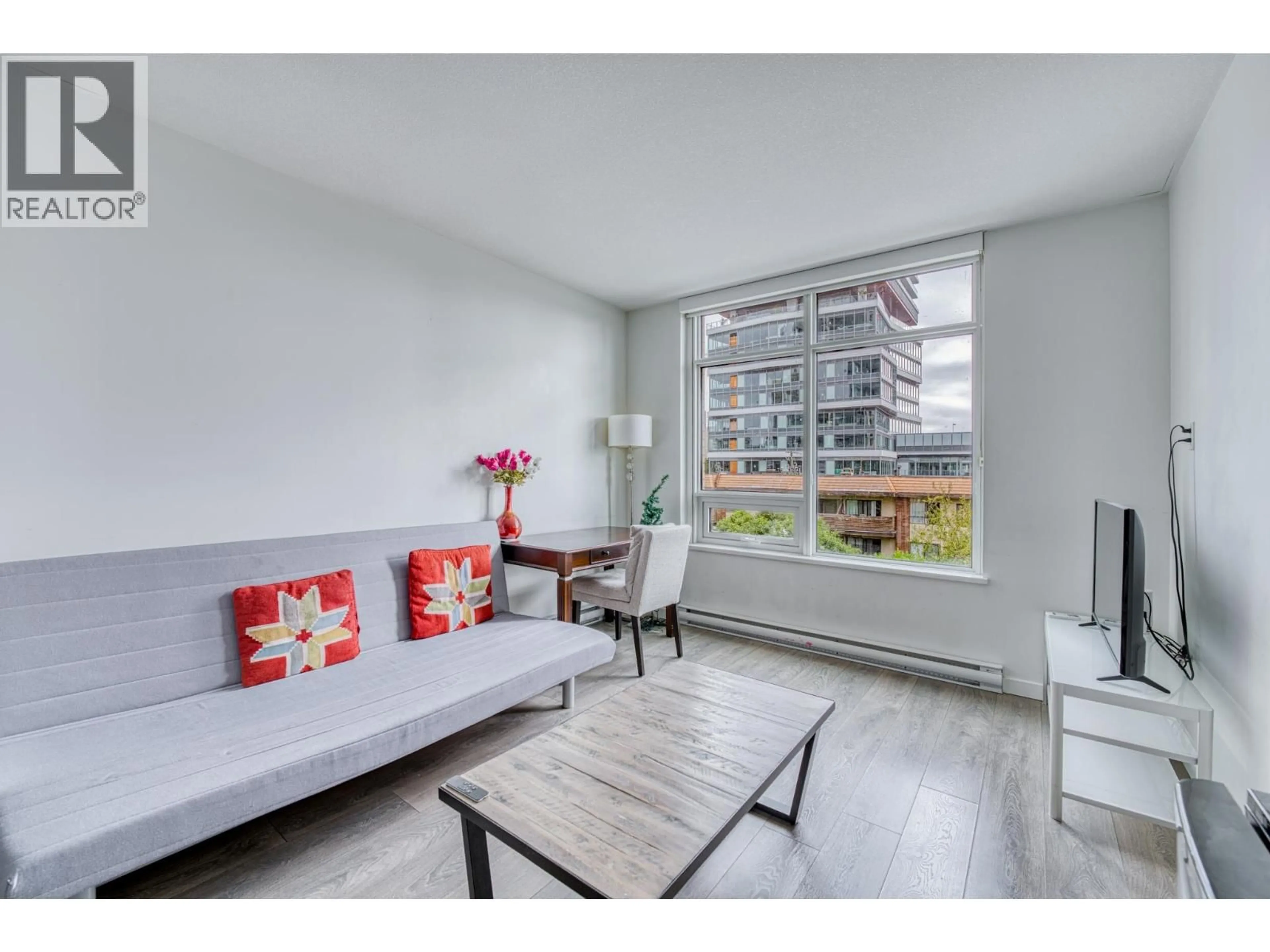 Living room with furniture, wood/laminate floor for 403 - 6461 TELFORD AVENUE, Burnaby British Columbia V5H0B7