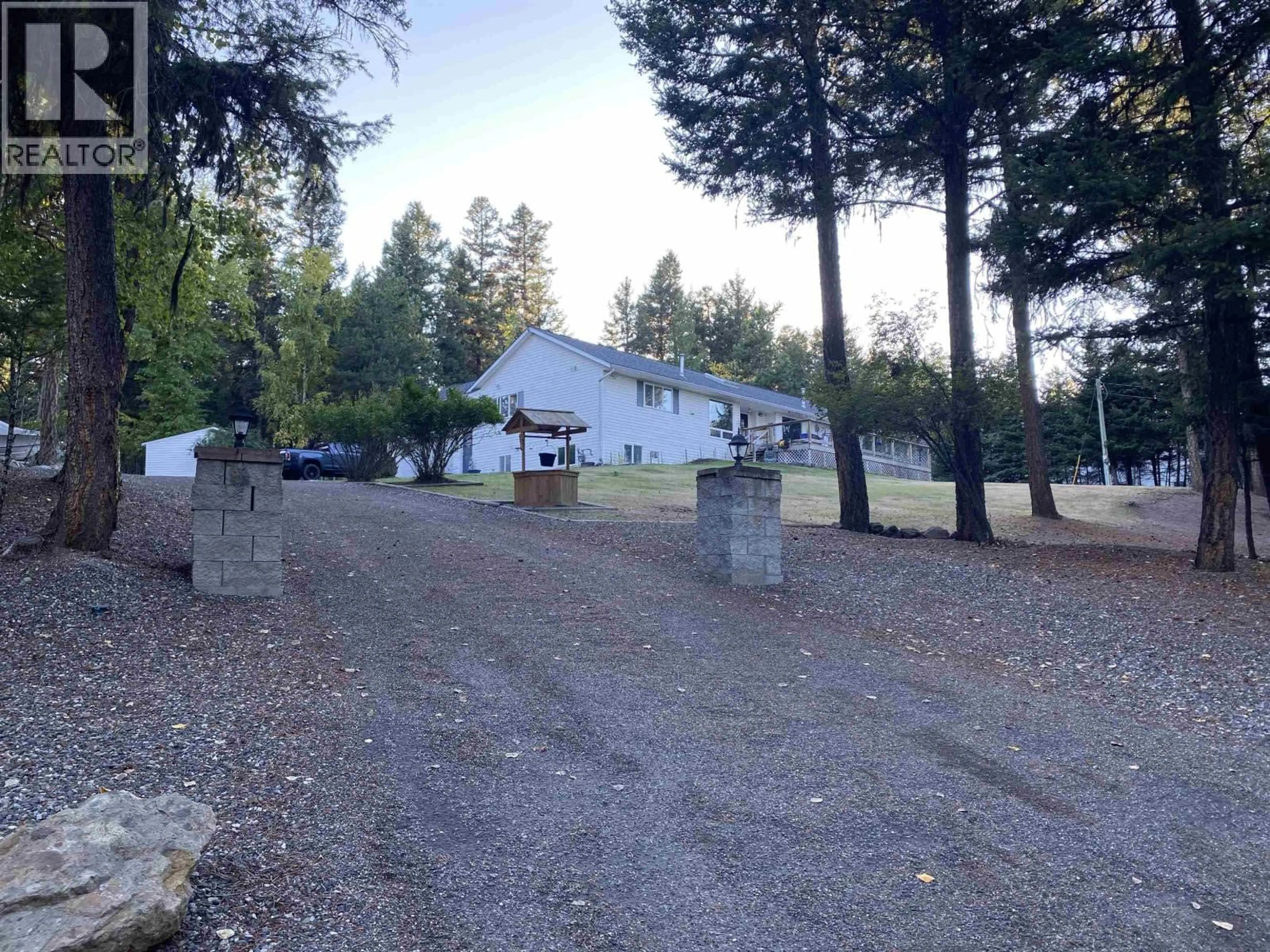 A pic from outside/outdoor area/front of a property/back of a property/a pic from drone, mountain view for 5270 MACKAY CRESCENT, 100 Mile House British Columbia V0K2Z0