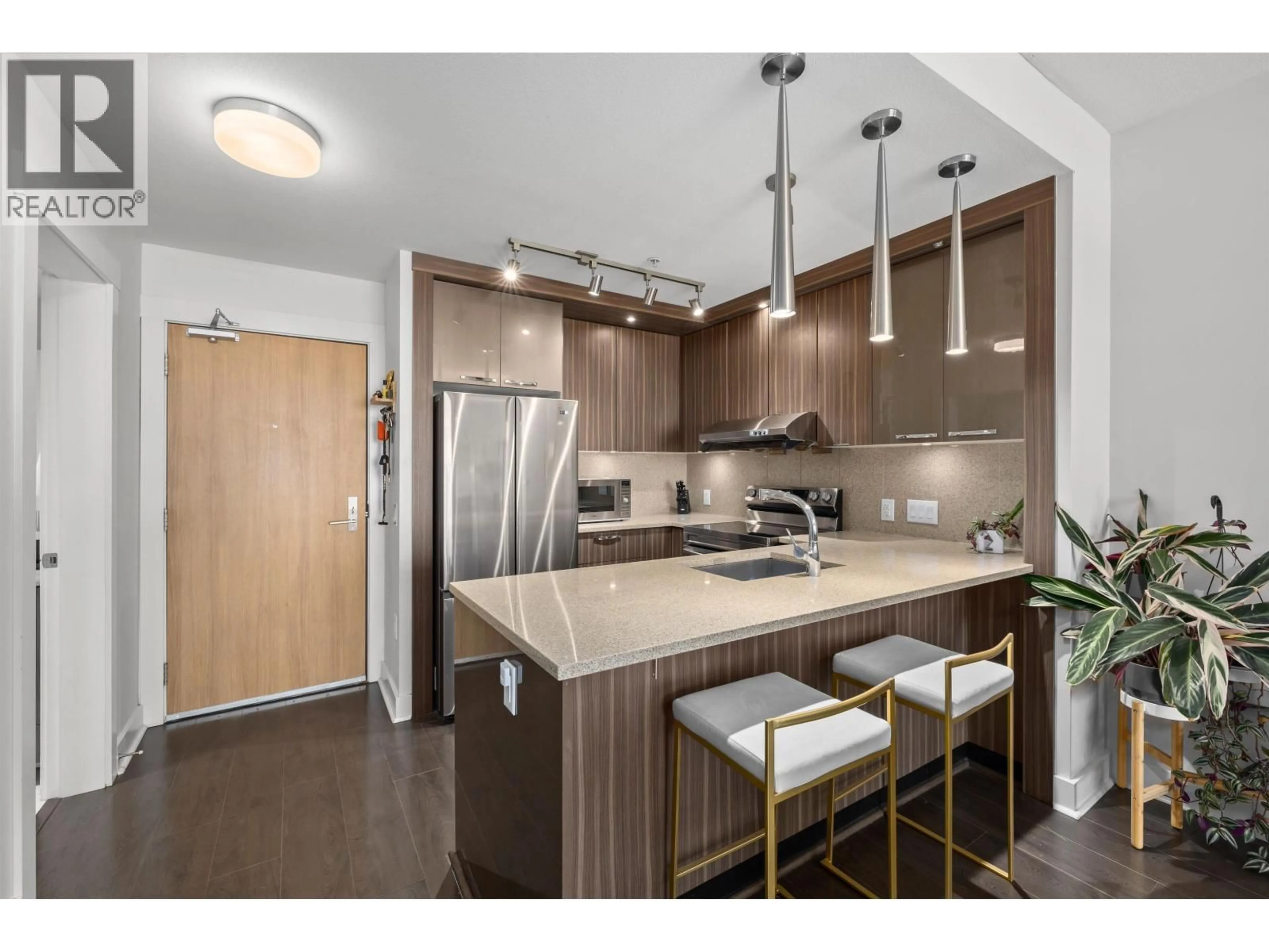 Open concept kitchen, wood/laminate floor for 305 - 733 14TH STREET, North Vancouver British Columbia V7M0C6