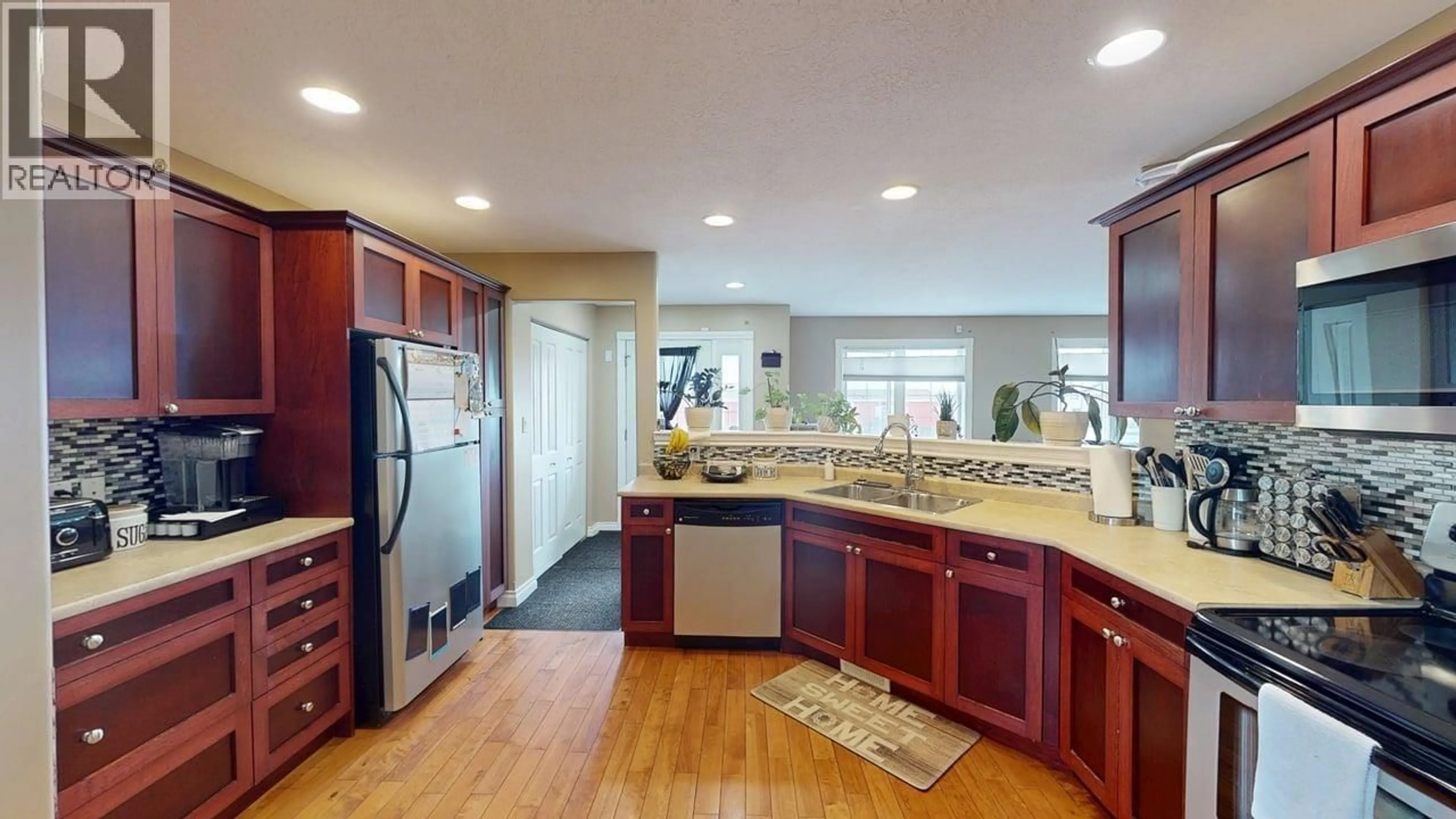 Open concept kitchen, ceramic/tile floor for 8508 82 STREET, Fort St. John British Columbia V1J0H1