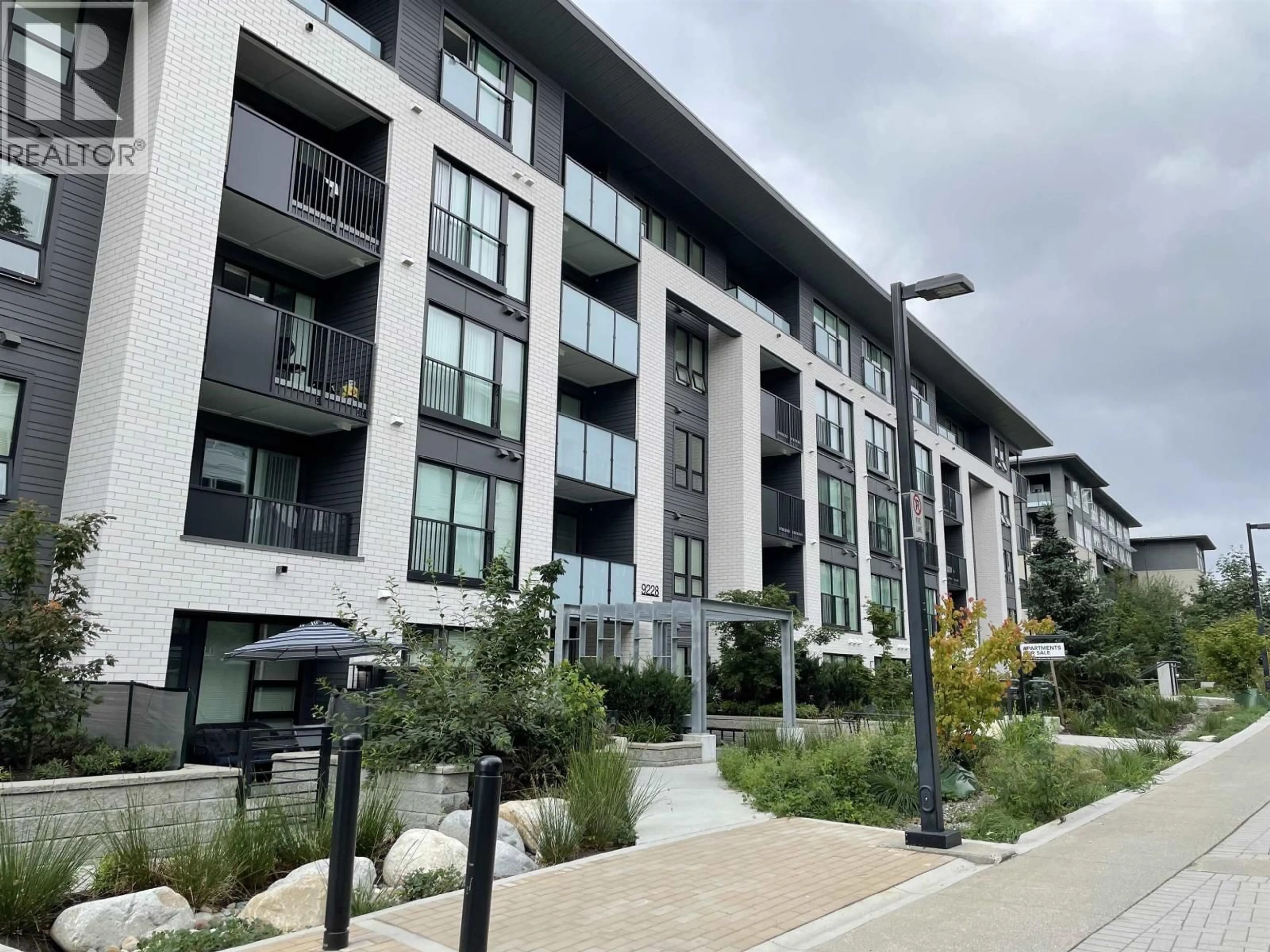 A pic from outside/outdoor area/front of a property/back of a property/a pic from drone, street for 306 - 9228 SLOPES MEWS, Burnaby British Columbia V5A0E9