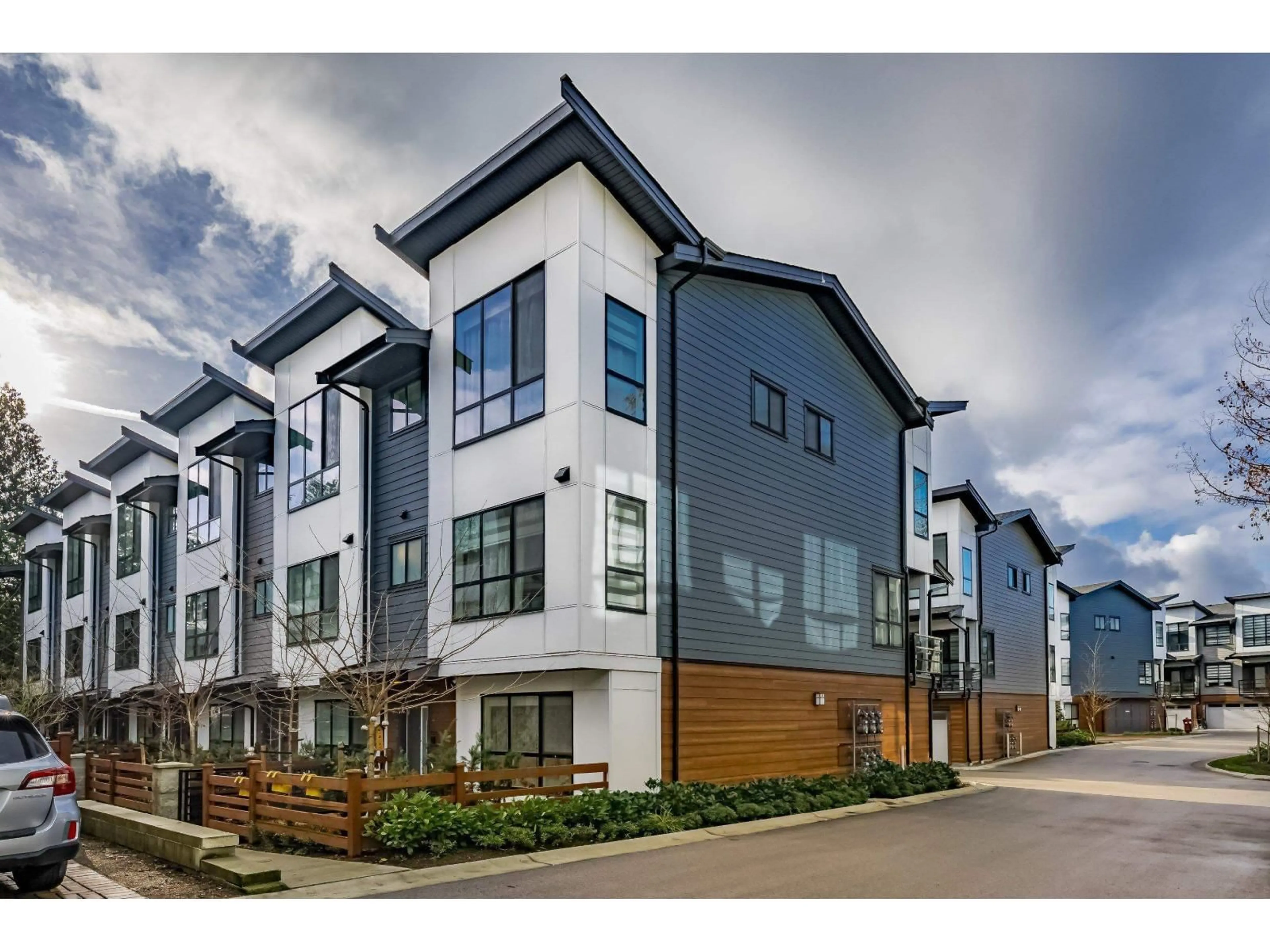 A pic from outside/outdoor area/front of a property/back of a property/a pic from drone, street for 71 - 7177 194A, Surrey British Columbia V4N6V6