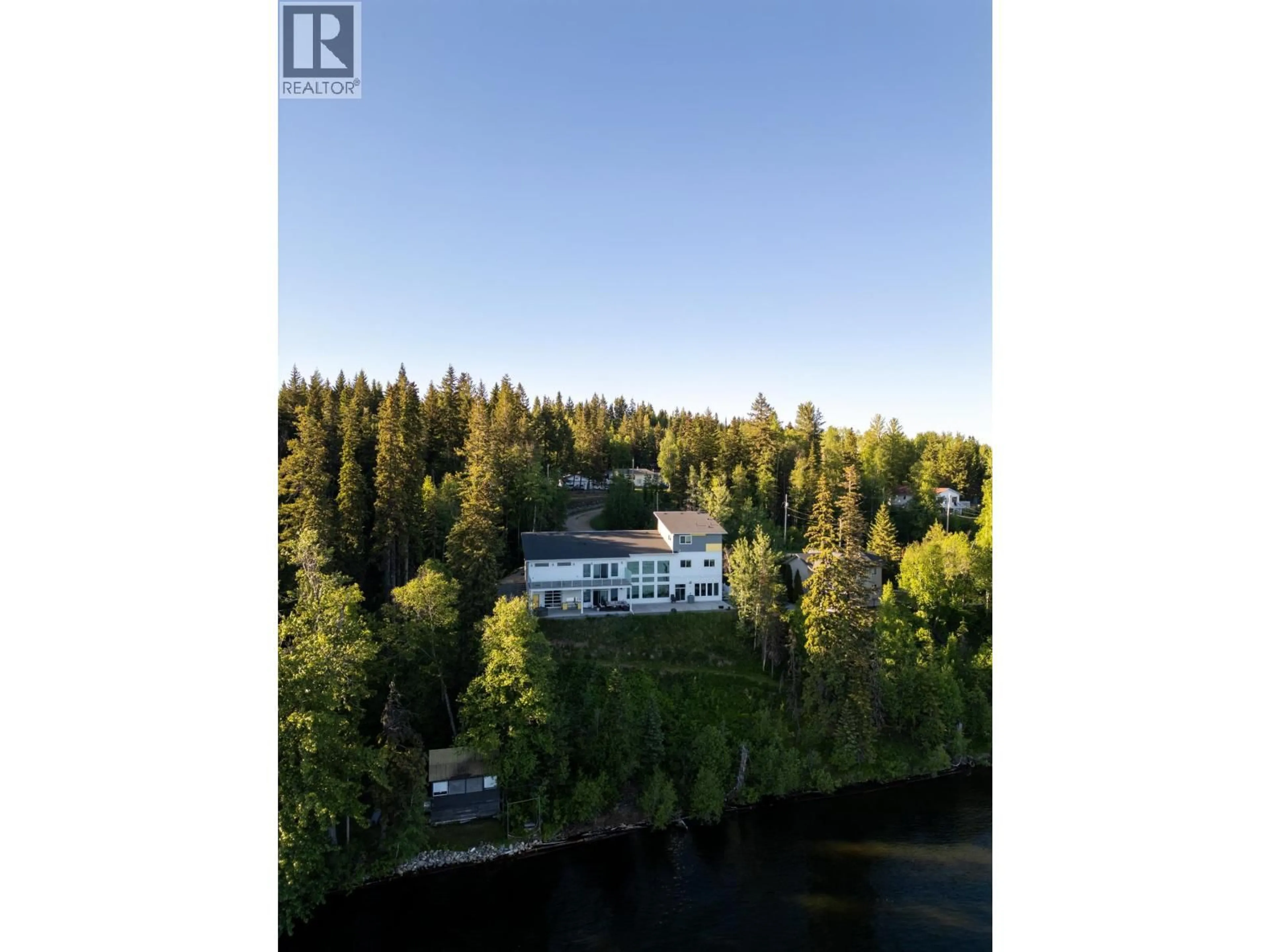 A pic from outside/outdoor area/front of a property/back of a property/a pic from drone, water/lake/river/ocean view for 140 RONDANE CRESCENT, Prince George British Columbia V2N6W3