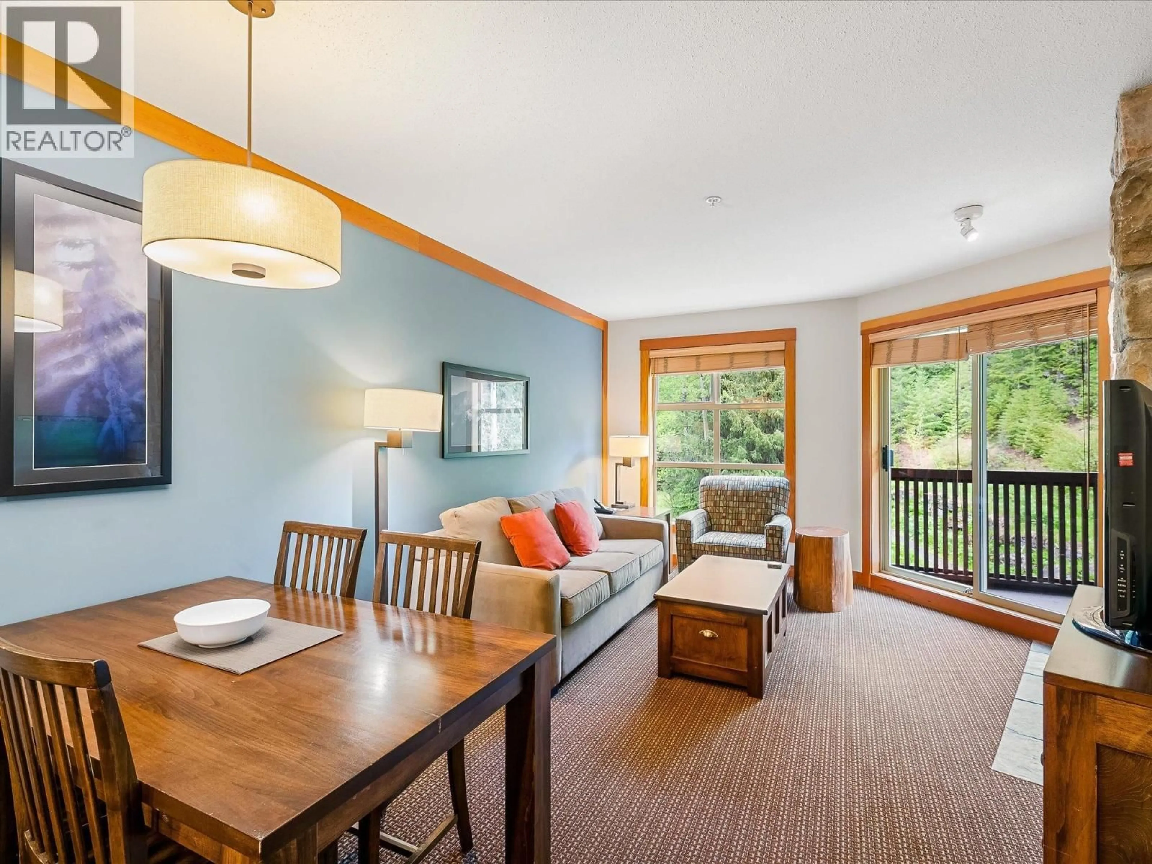 Living room with furniture, wood/laminate floor for 436D - 2036 LONDON LANE, Whistler British Columbia V8E0N7