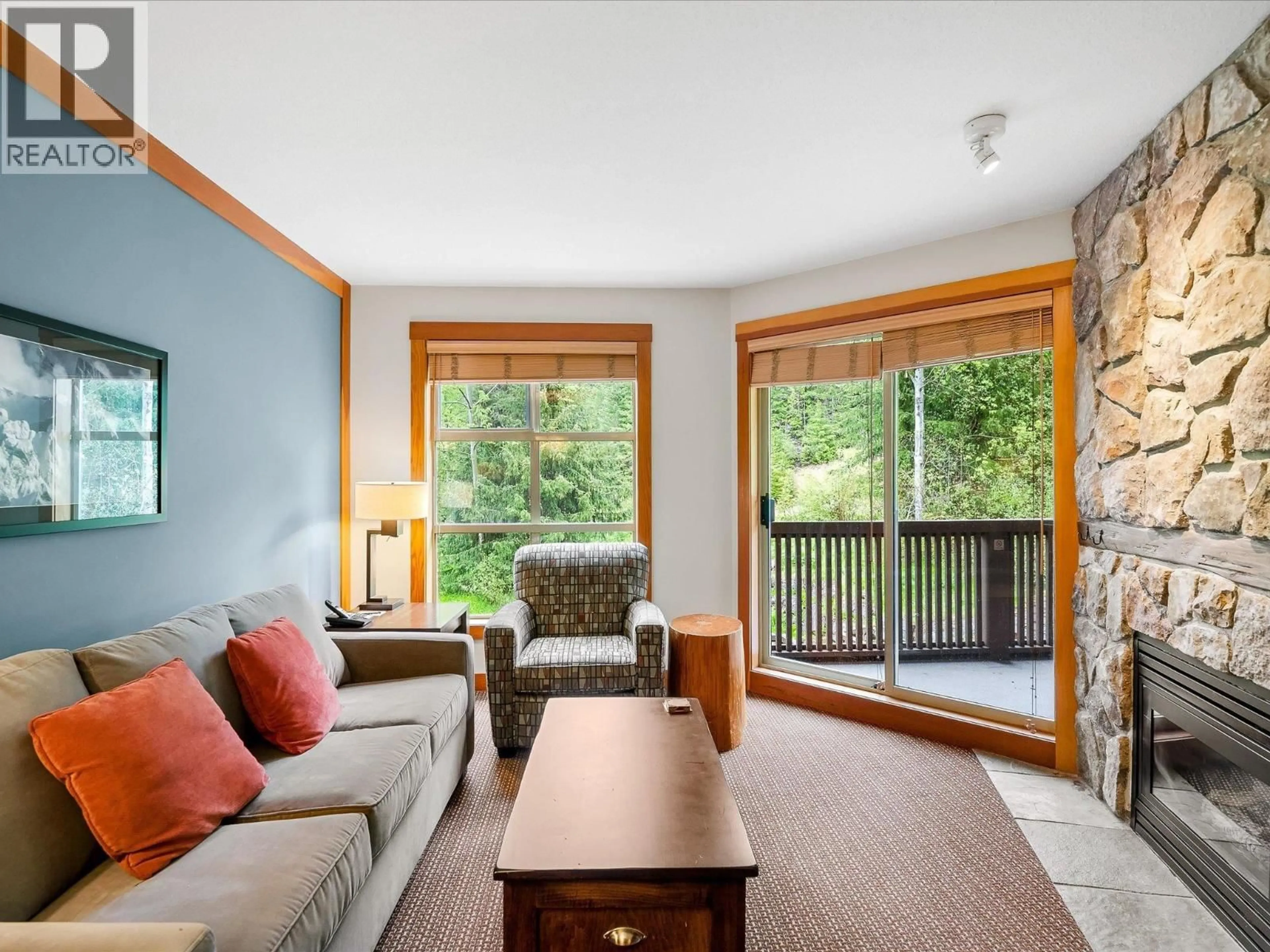 Living room with furniture, wood/laminate floor for 436D - 2036 LONDON LANE, Whistler British Columbia V8E0N7
