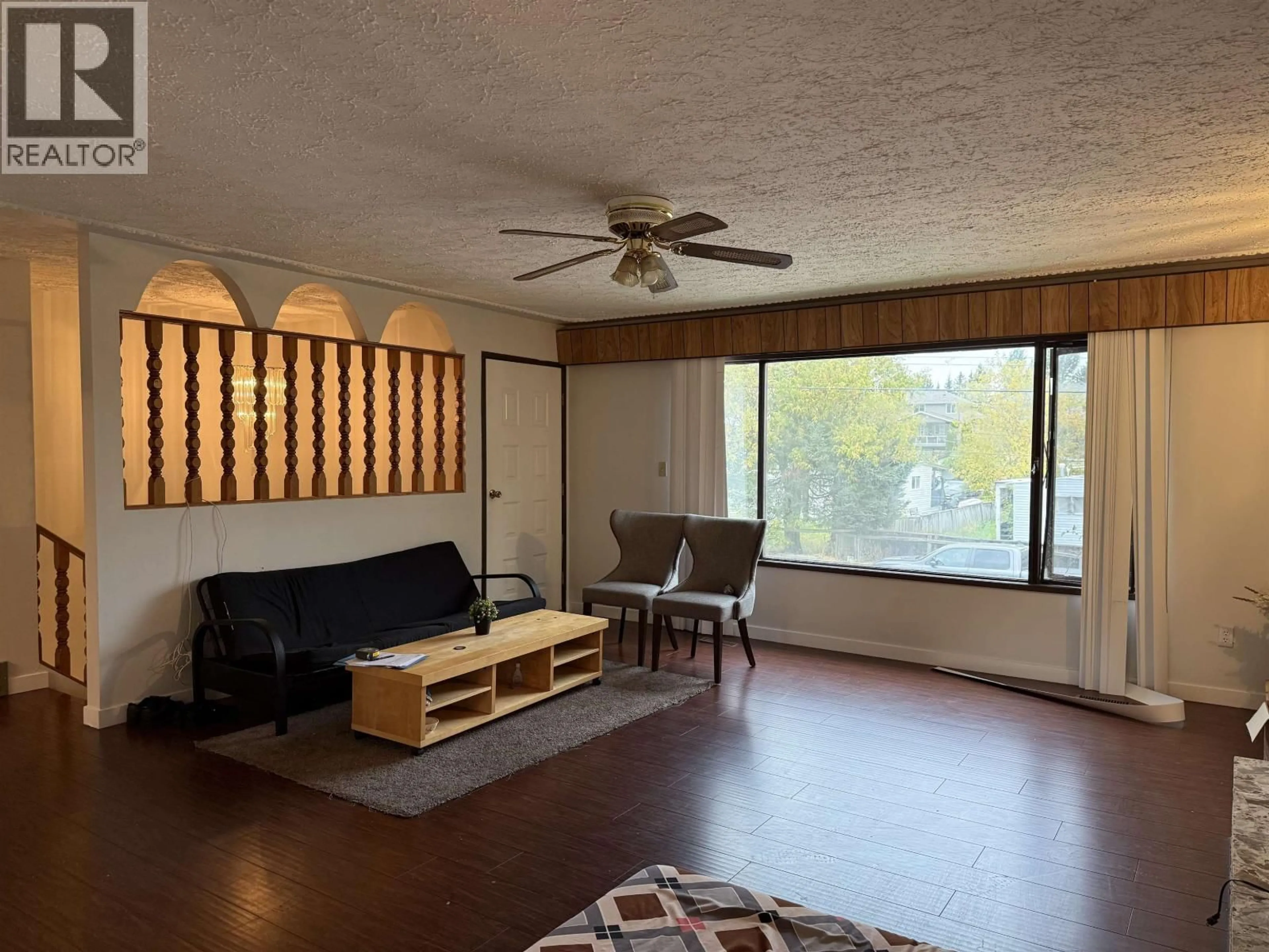 Living room with furniture, wood/laminate floor for 2833 RANGE ROAD, Prince George British Columbia V2N1M3