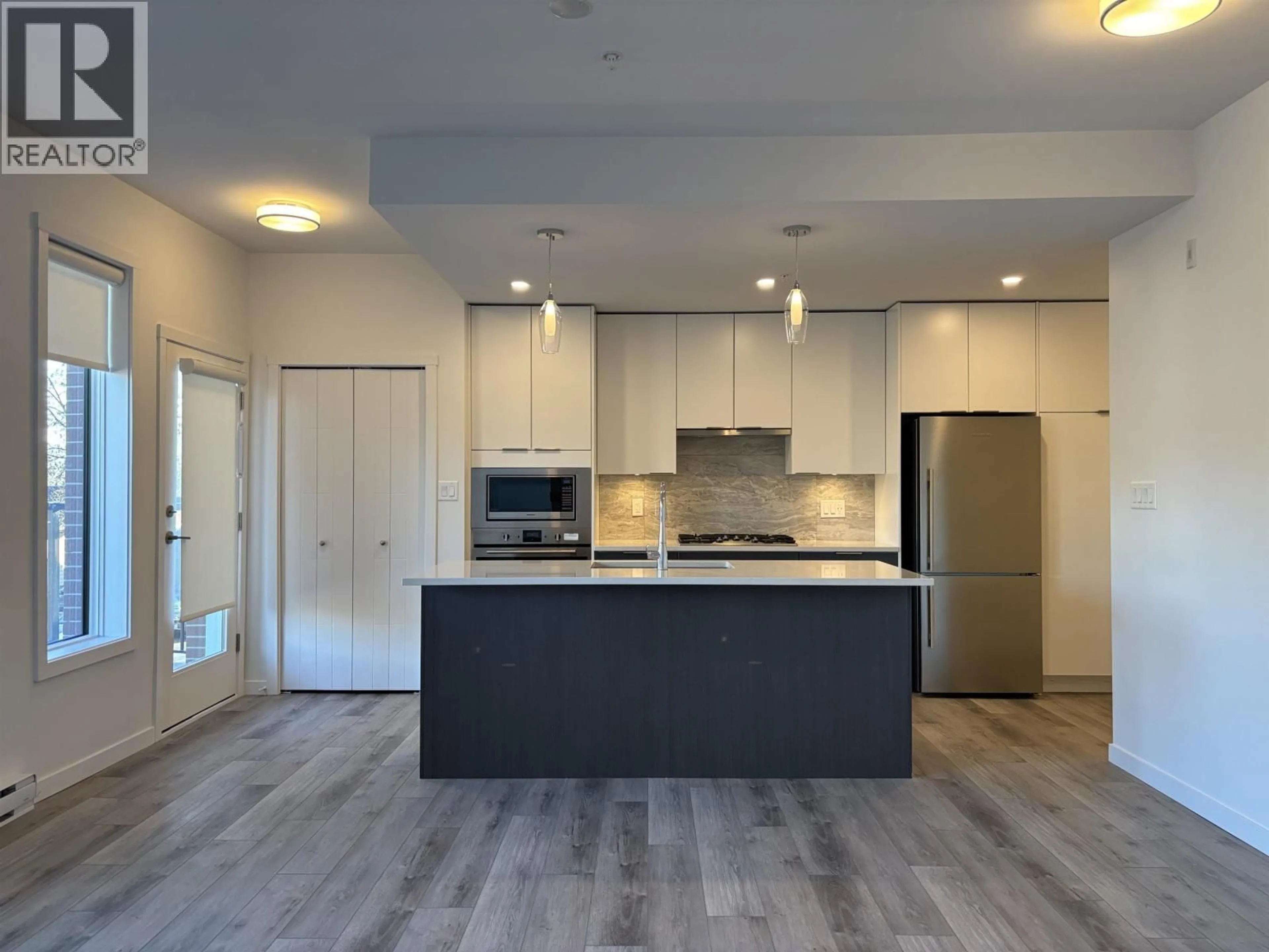 Open concept kitchen, wood/laminate floor for 104 - 11639 227 STREET, Maple Ridge British Columbia V2X9J6