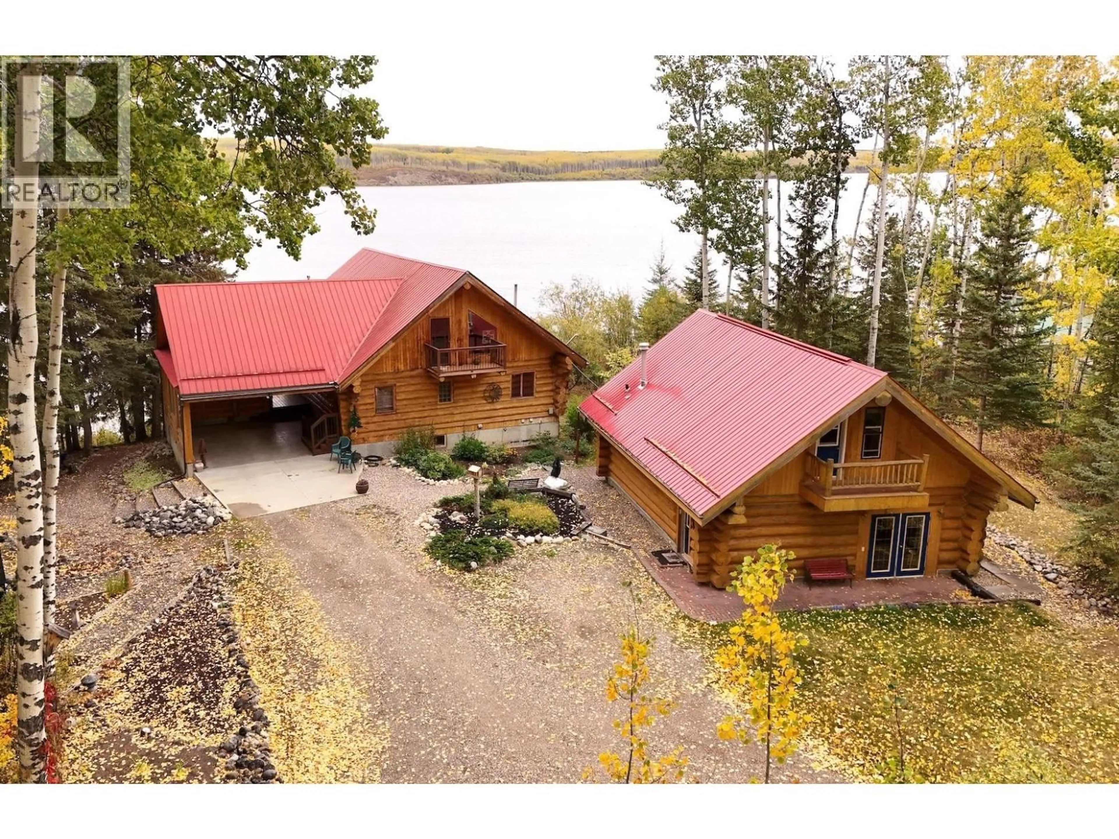A pic from outside/outdoor area/front of a property/back of a property/a pic from drone, water/lake/river/ocean view for 13819 GOLF COURSE ROAD, Charlie Lake British Columbia V0C1H0