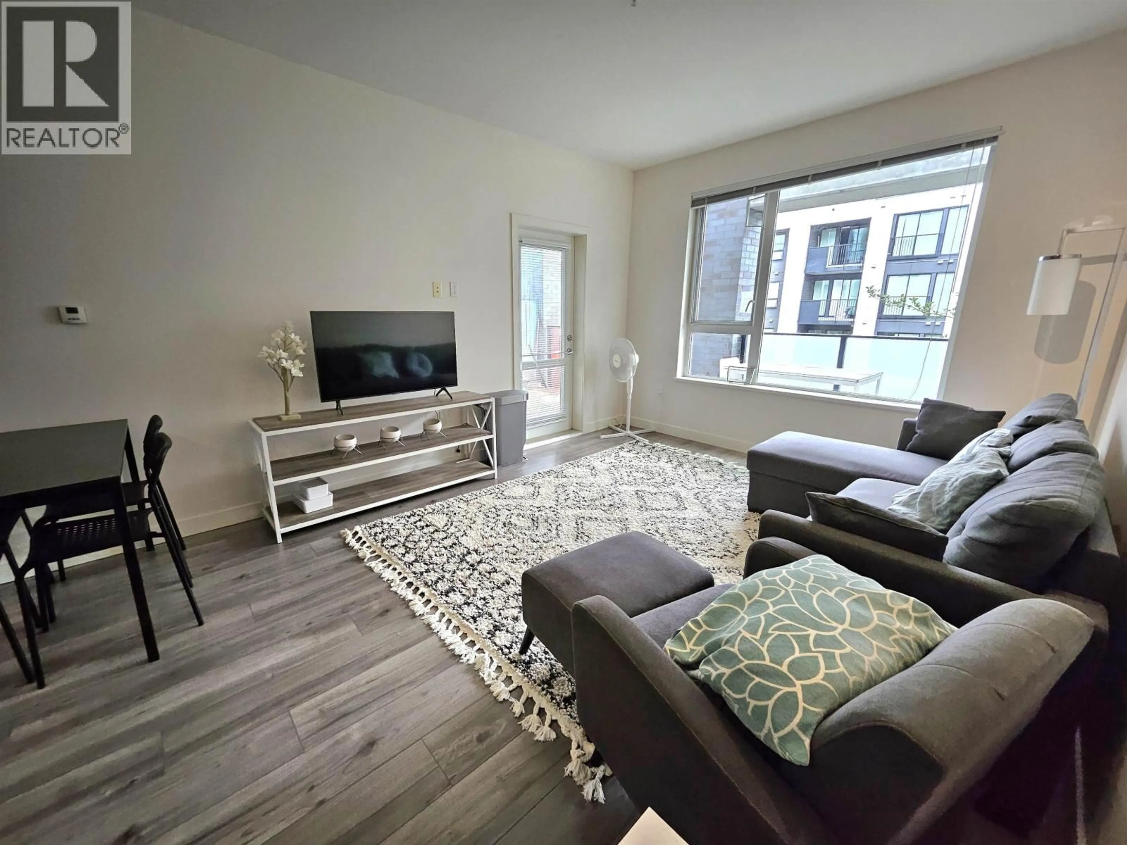Living room with furniture, unknown for 209 - 9250 UNIVERSITY HIGH STREET, Burnaby British Columbia V5A0B3