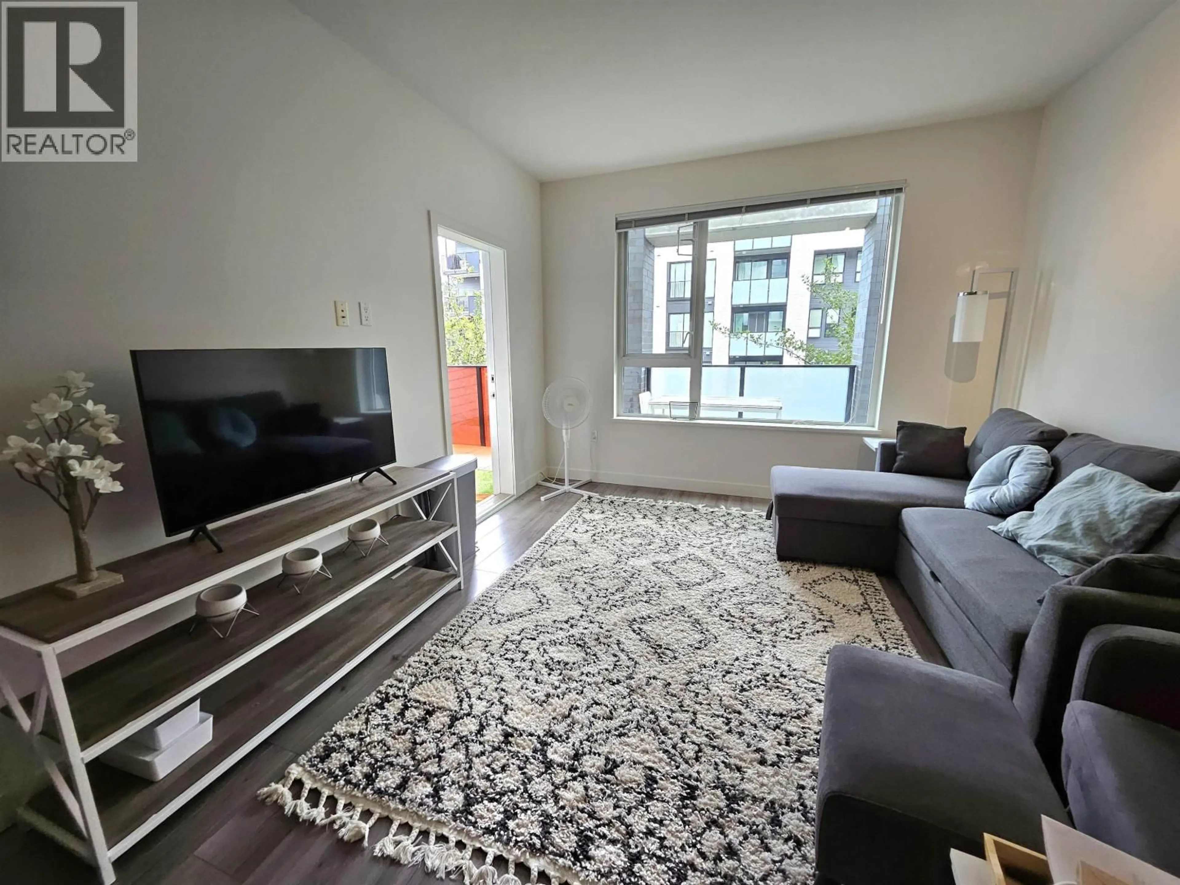 Living room with furniture, unknown for 209 - 9250 UNIVERSITY HIGH STREET, Burnaby British Columbia V5A0B3