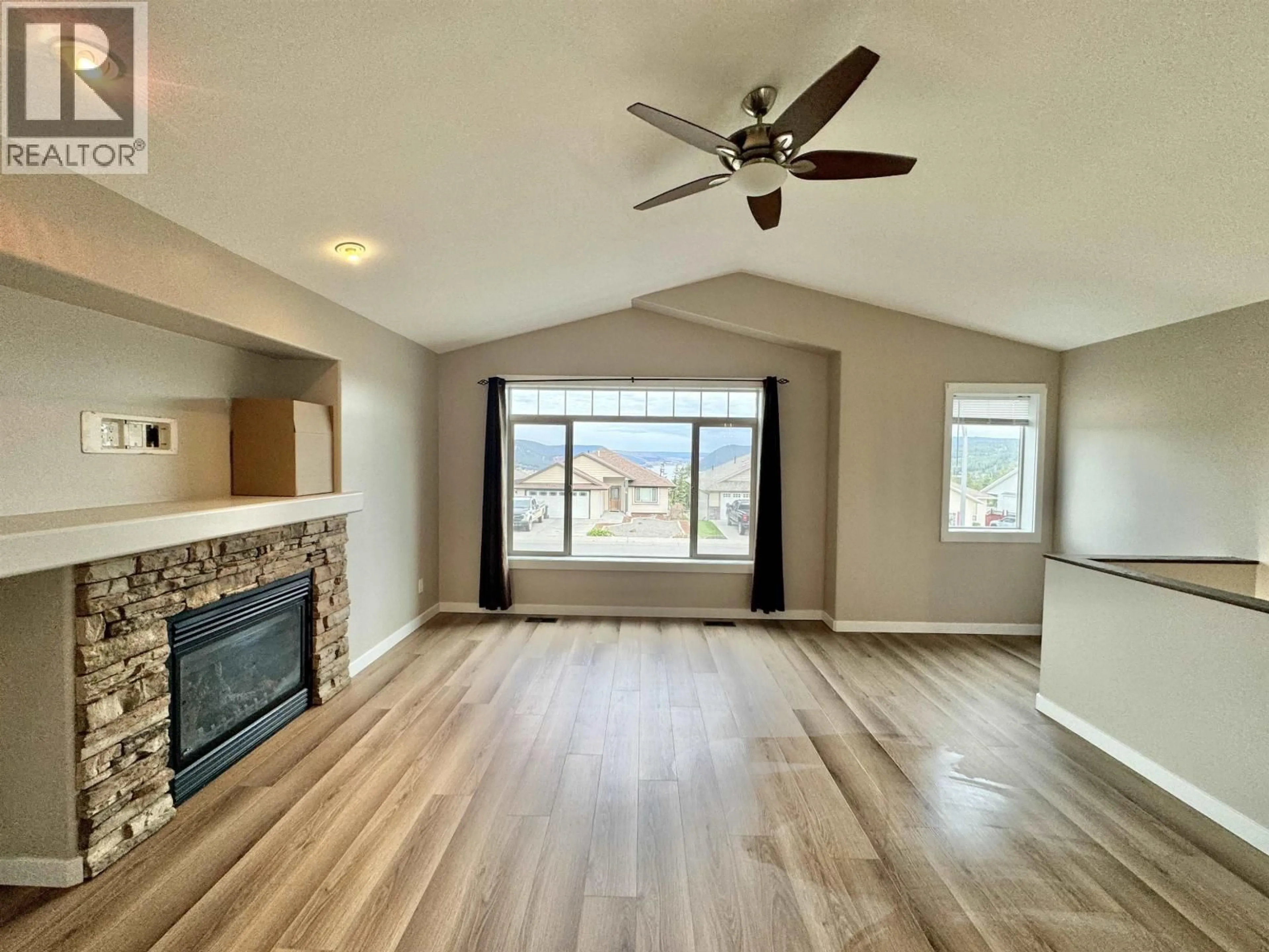 Living room with furniture, wood/laminate floor for 97 EAGLE CRESCENT, Williams Lake British Columbia V2G5K2