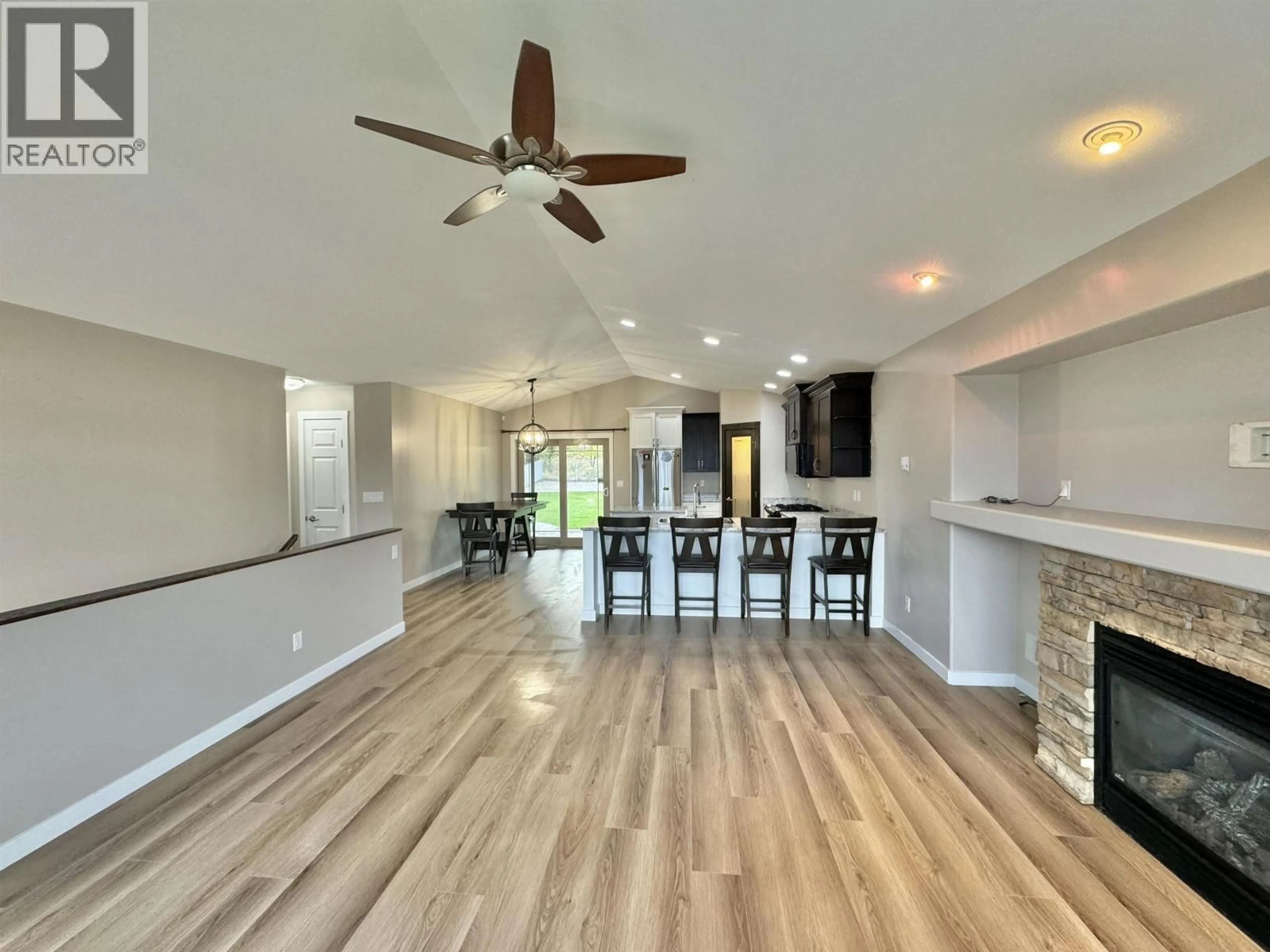 Open concept kitchen, wood/laminate floor for 97 EAGLE CRESCENT, Williams Lake British Columbia V2G5K2