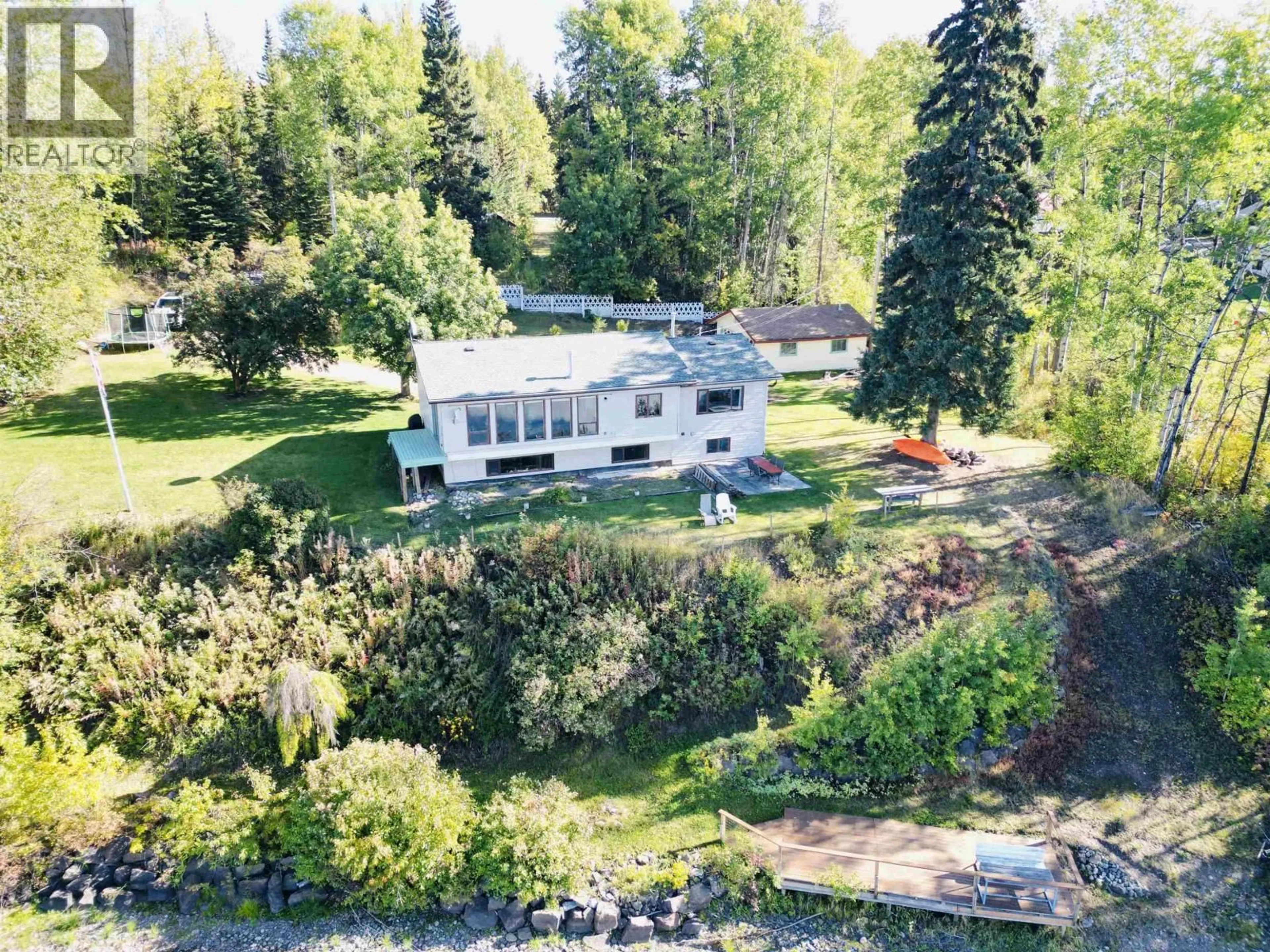 A pic from outside/outdoor area/front of a property/back of a property/a pic from drone, water/lake/river/ocean view for 8003 ROWLAND ROAD, Burns Lake British Columbia V0J1E1