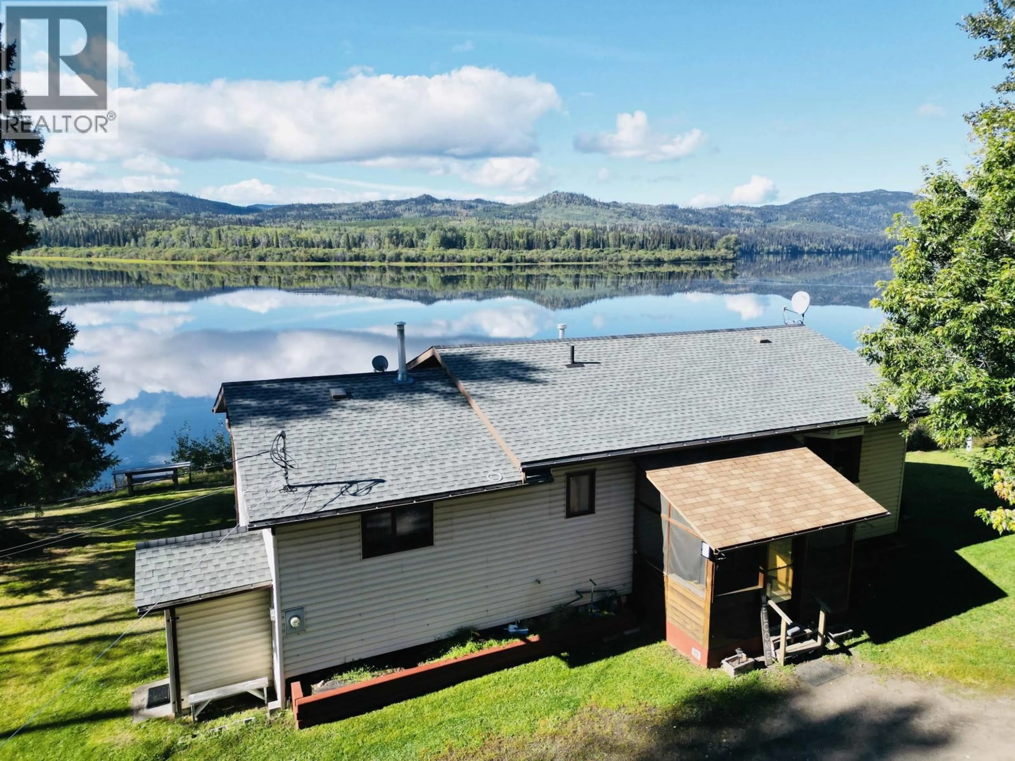 A pic from outside/outdoor area/front of a property/back of a property/a pic from drone, water/lake/river/ocean view for 8003 ROWLAND ROAD, Burns Lake British Columbia V0J1E1