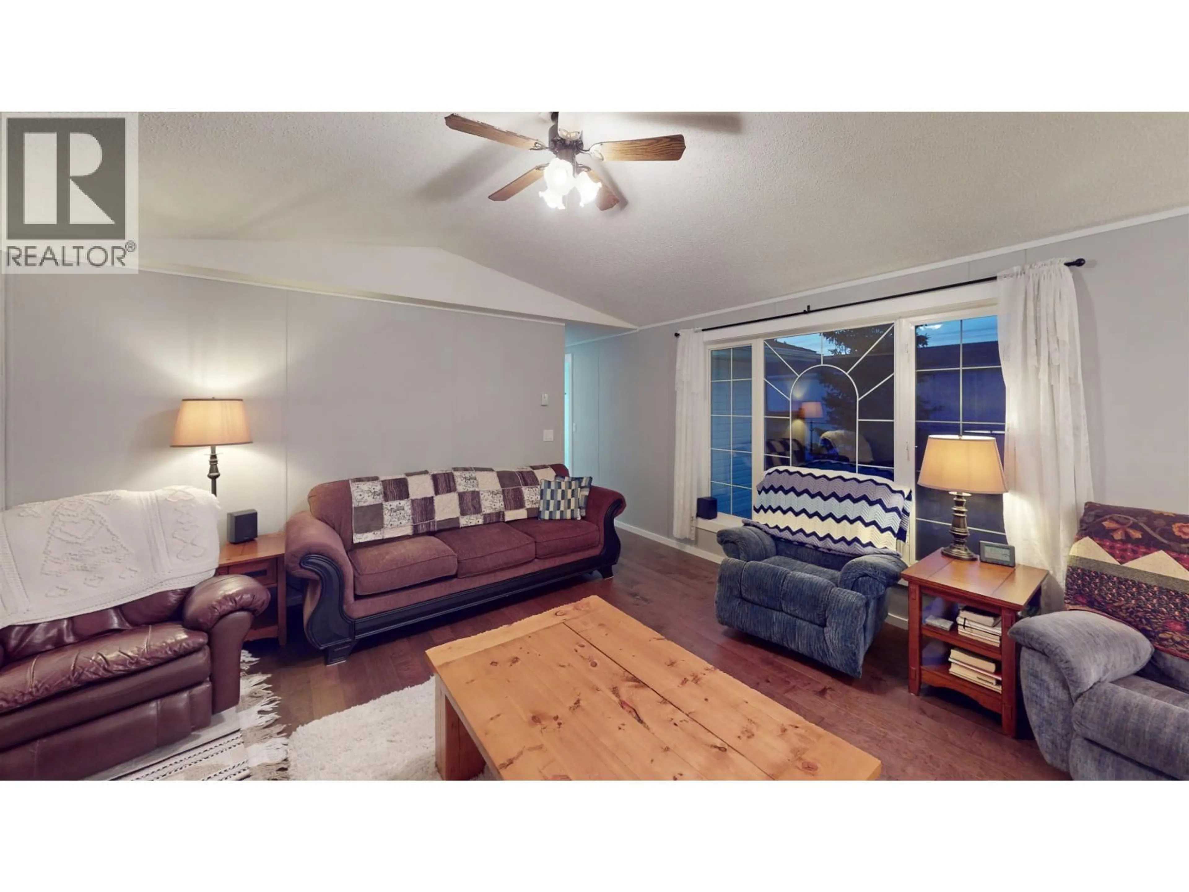 Living room with furniture, wood/laminate floor for 10439 99 STREET, Taylor British Columbia V0C2K0