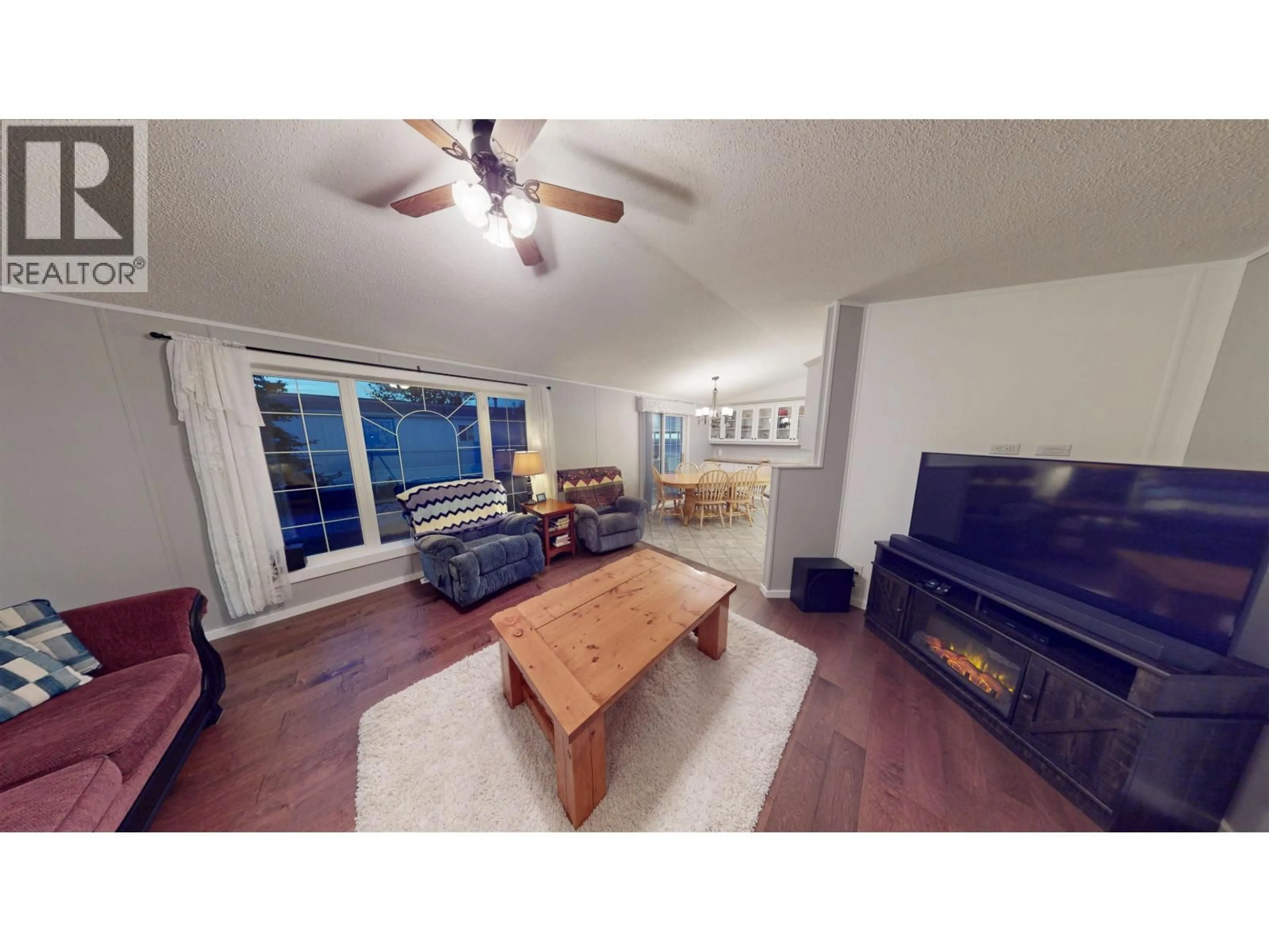 Living room with furniture, wood/laminate floor for 10439 99 STREET, Taylor British Columbia V0C2K0