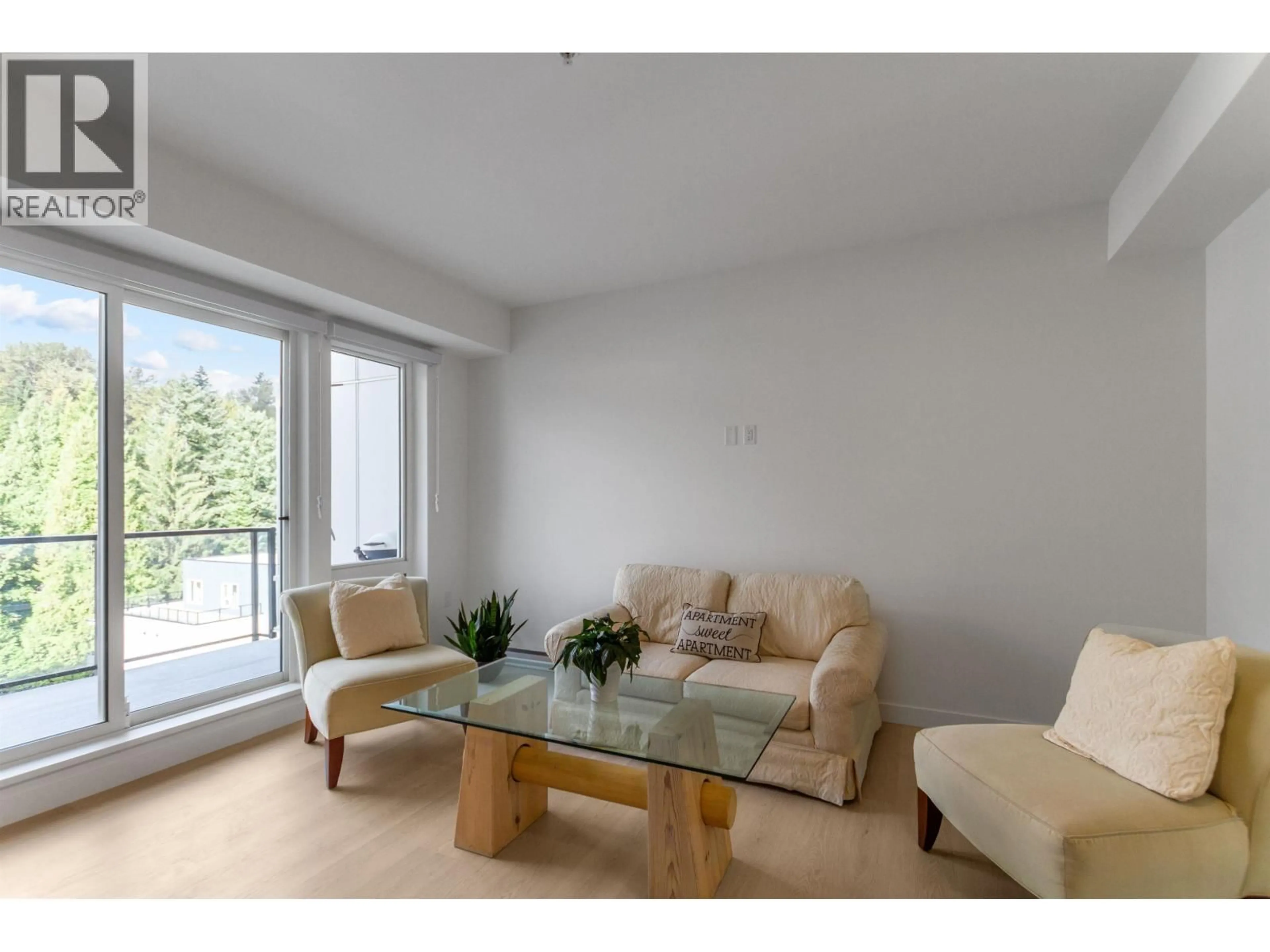 Living room with furniture, wood/laminate floor for 606 - 2002 ST. GEORGE STREET, Port Moody British Columbia V3H0N4