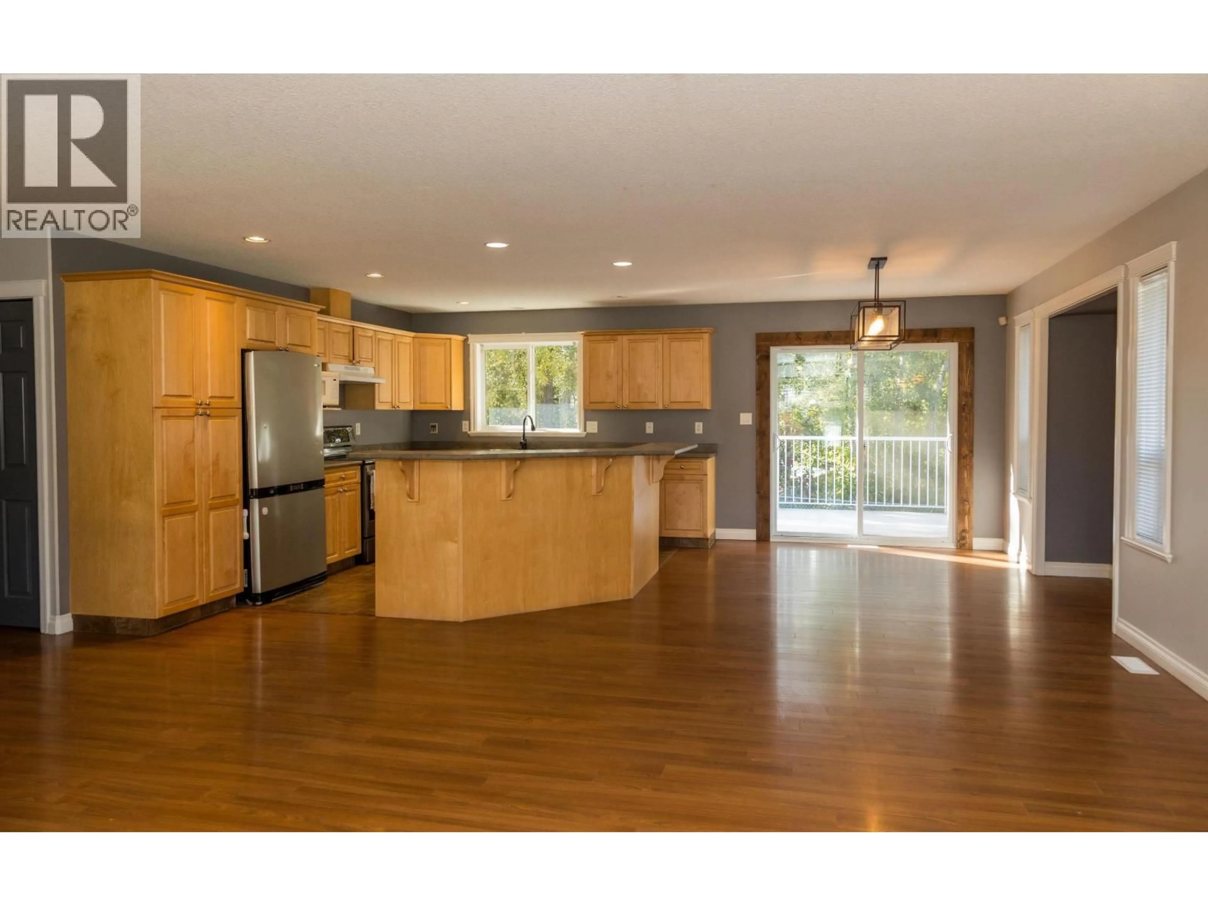 Open concept kitchen, wood/laminate floor for 6897 EUGENE ROAD, Prince George British Columbia V2N5P6