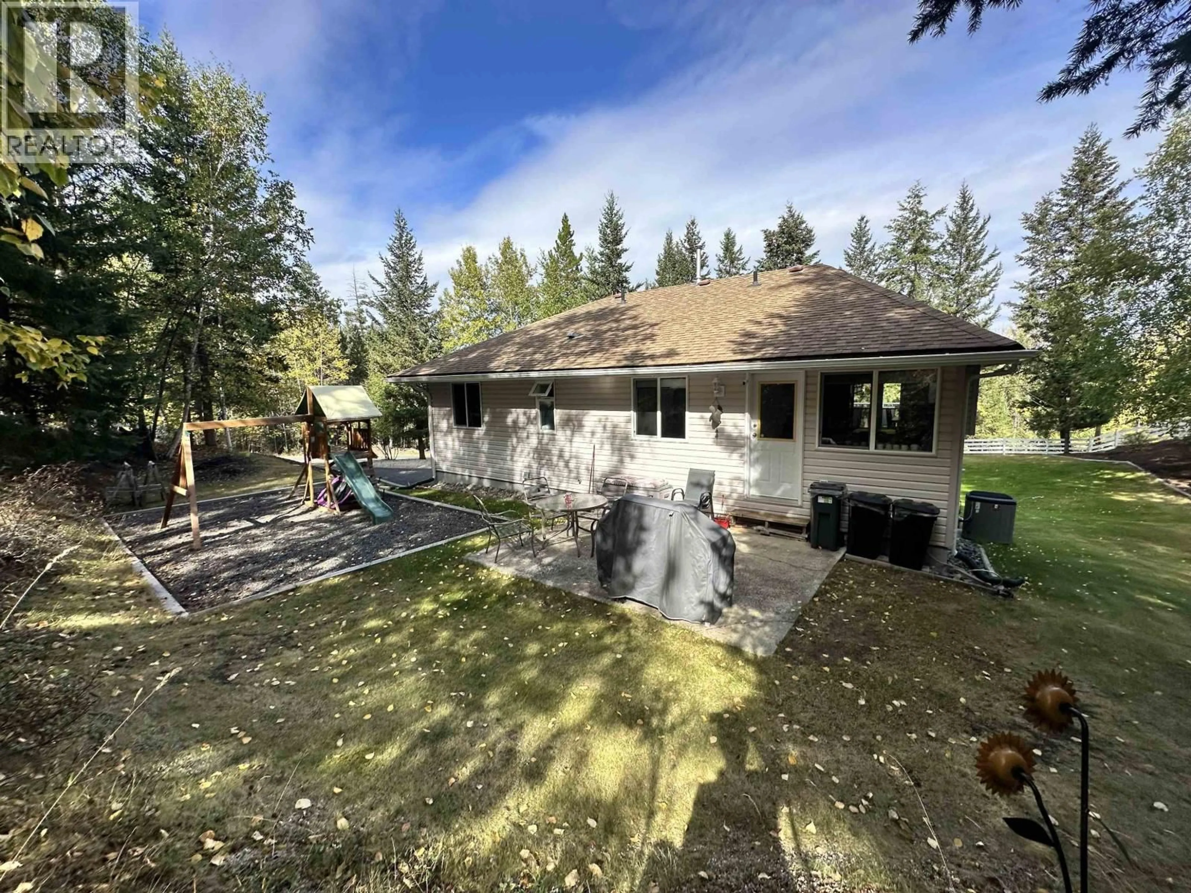 A pic from outside/outdoor area/front of a property/back of a property/a pic from drone, forest/trees view for 5236 KALLUM DRIVE, 108 Mile Ranch British Columbia V0K2Z0