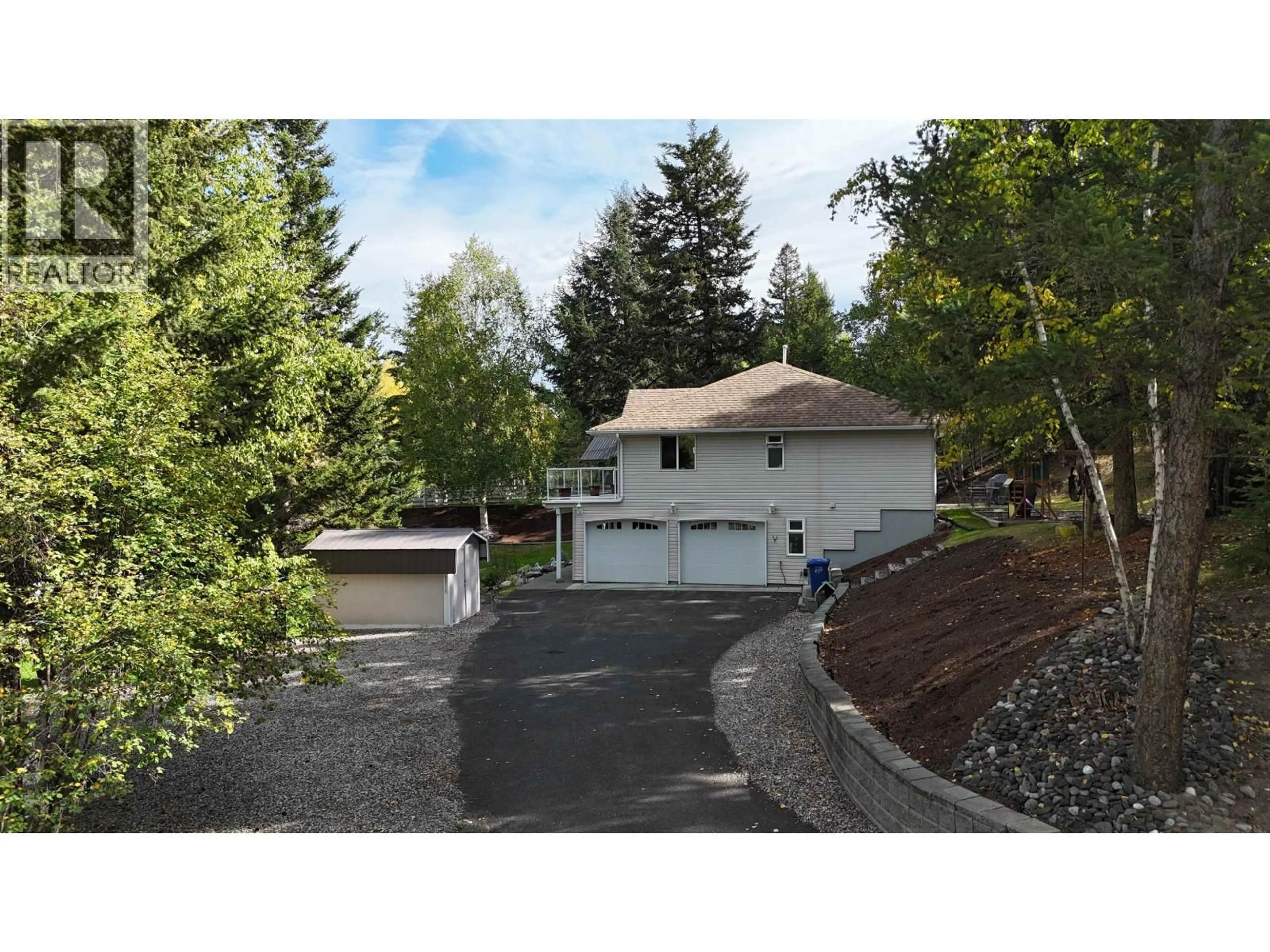 A pic from outside/outdoor area/front of a property/back of a property/a pic from drone, street for 5236 KALLUM DRIVE, 108 Mile Ranch British Columbia V0K2Z0