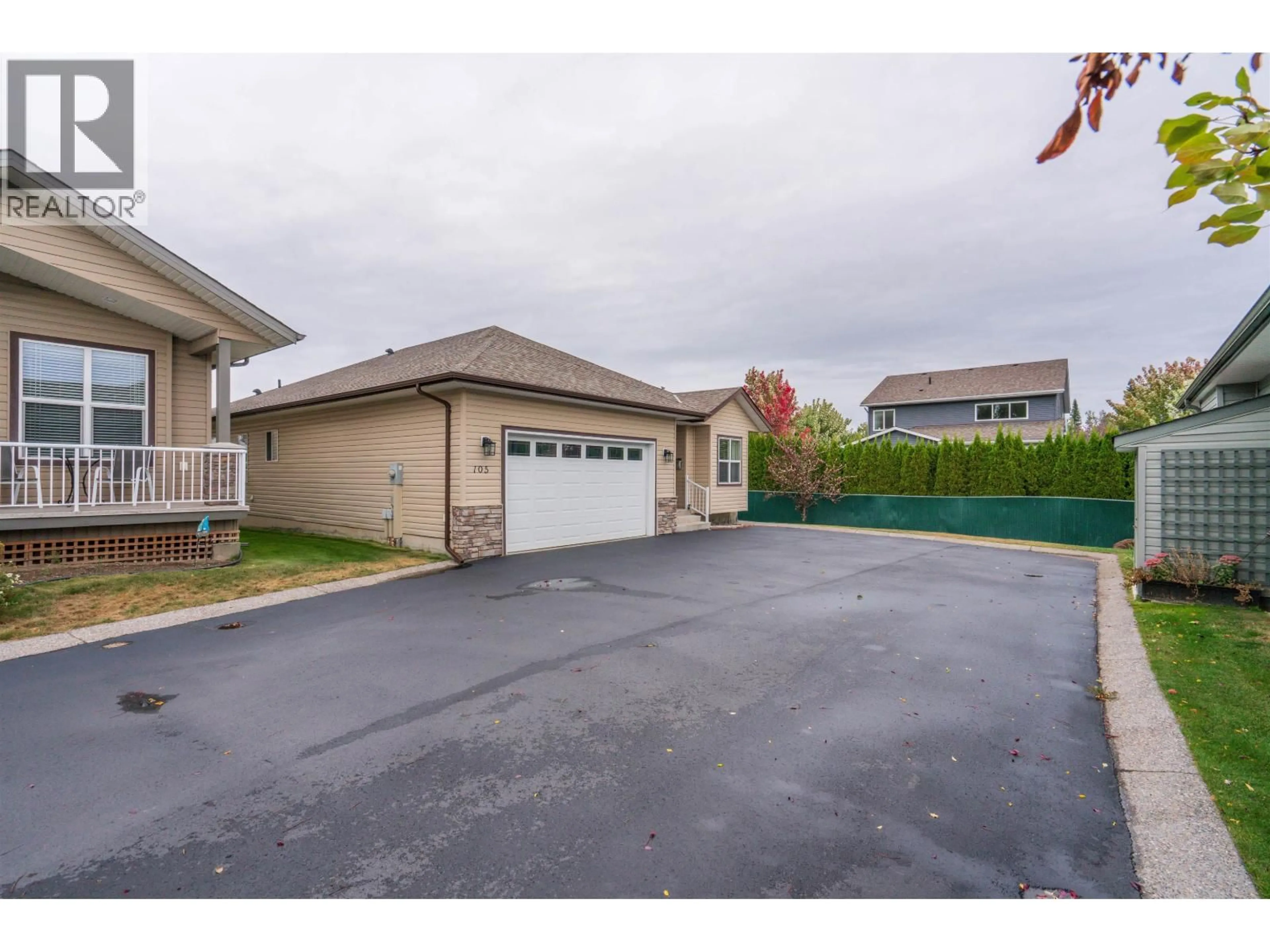 A pic from outside/outdoor area/front of a property/back of a property/a pic from drone, street for 105 - 4272 DAVIS ROAD, Prince George British Columbia V2N0B3
