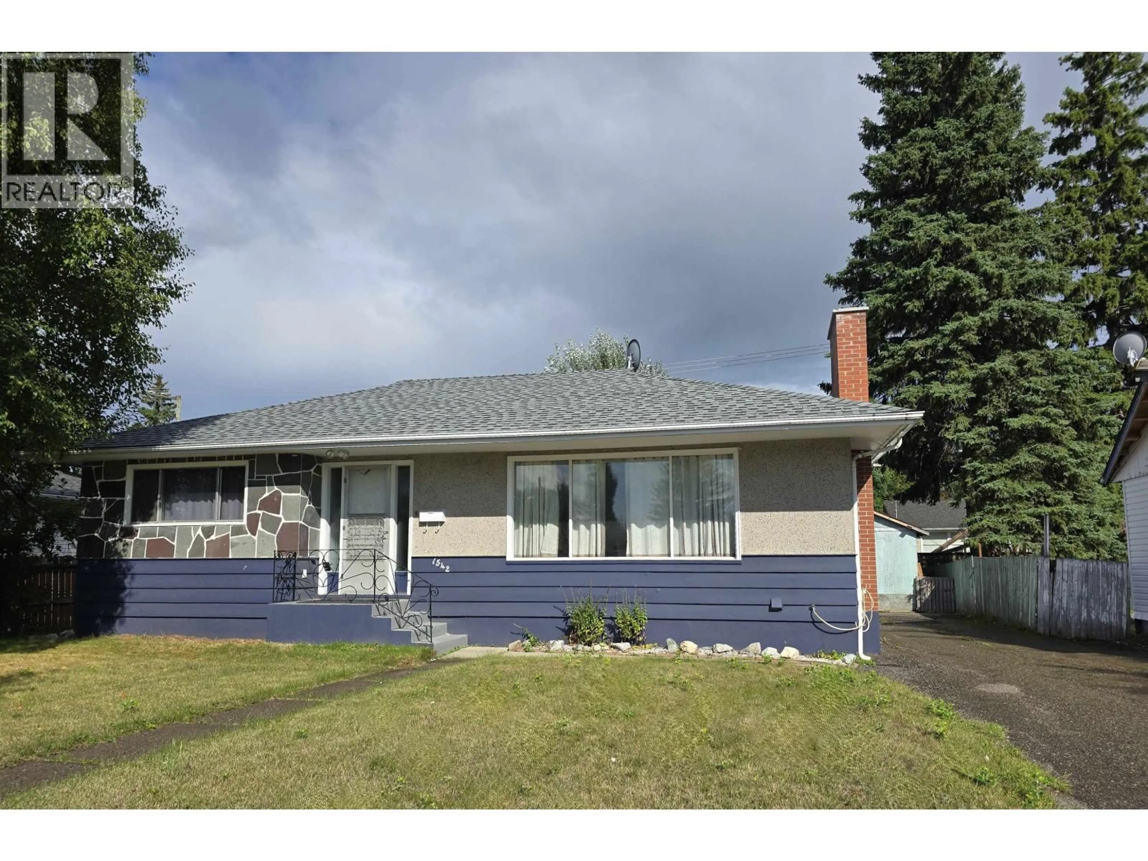 Home with vinyl exterior material, street for 1542 CARNEY STREET, Prince George British Columbia V2M2L5