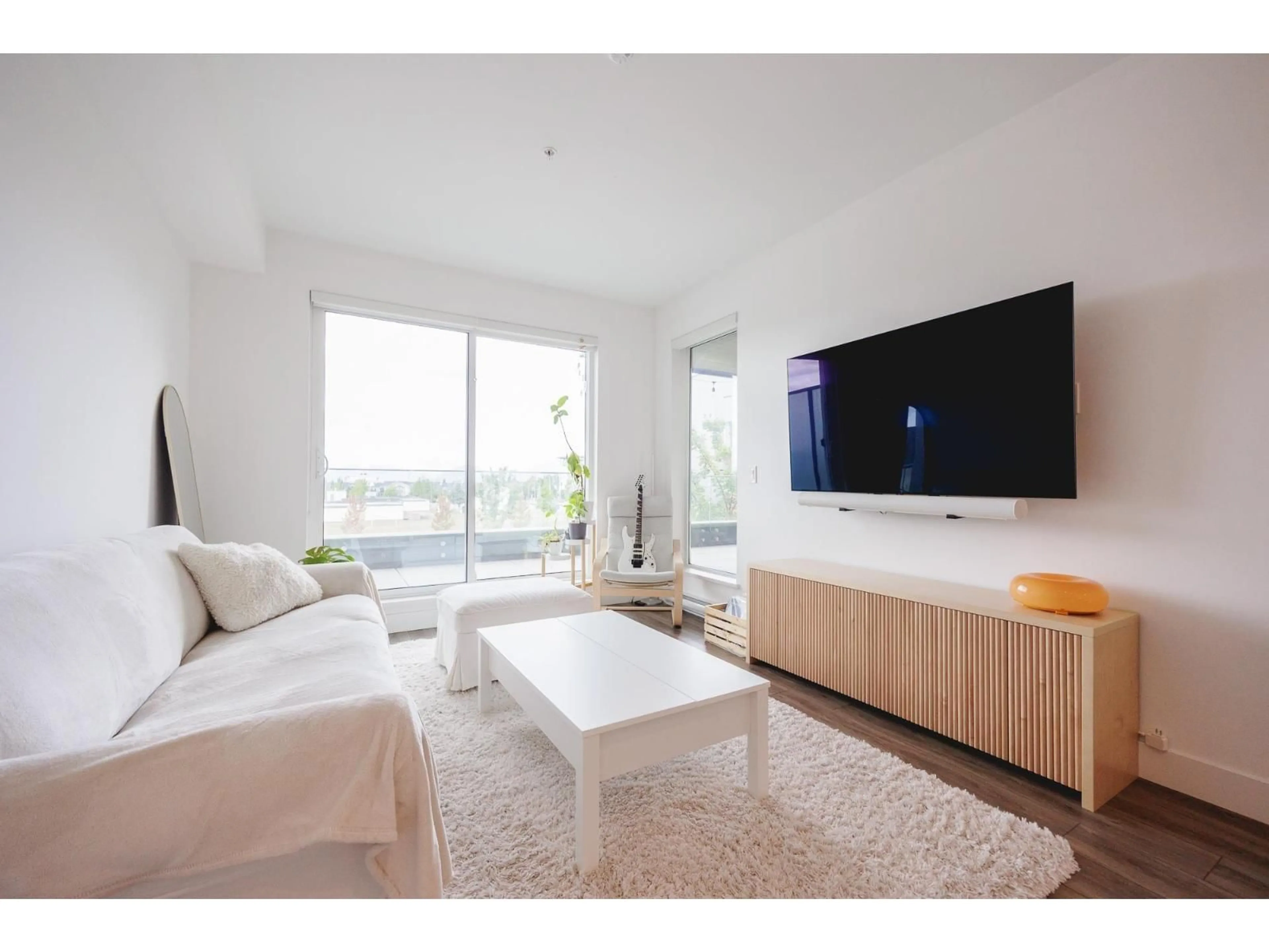 Living room with furniture, wood/laminate floor for A224 - 20727 WILLOUGHBY TOWN CENTRE, Langley British Columbia V2Y3N1