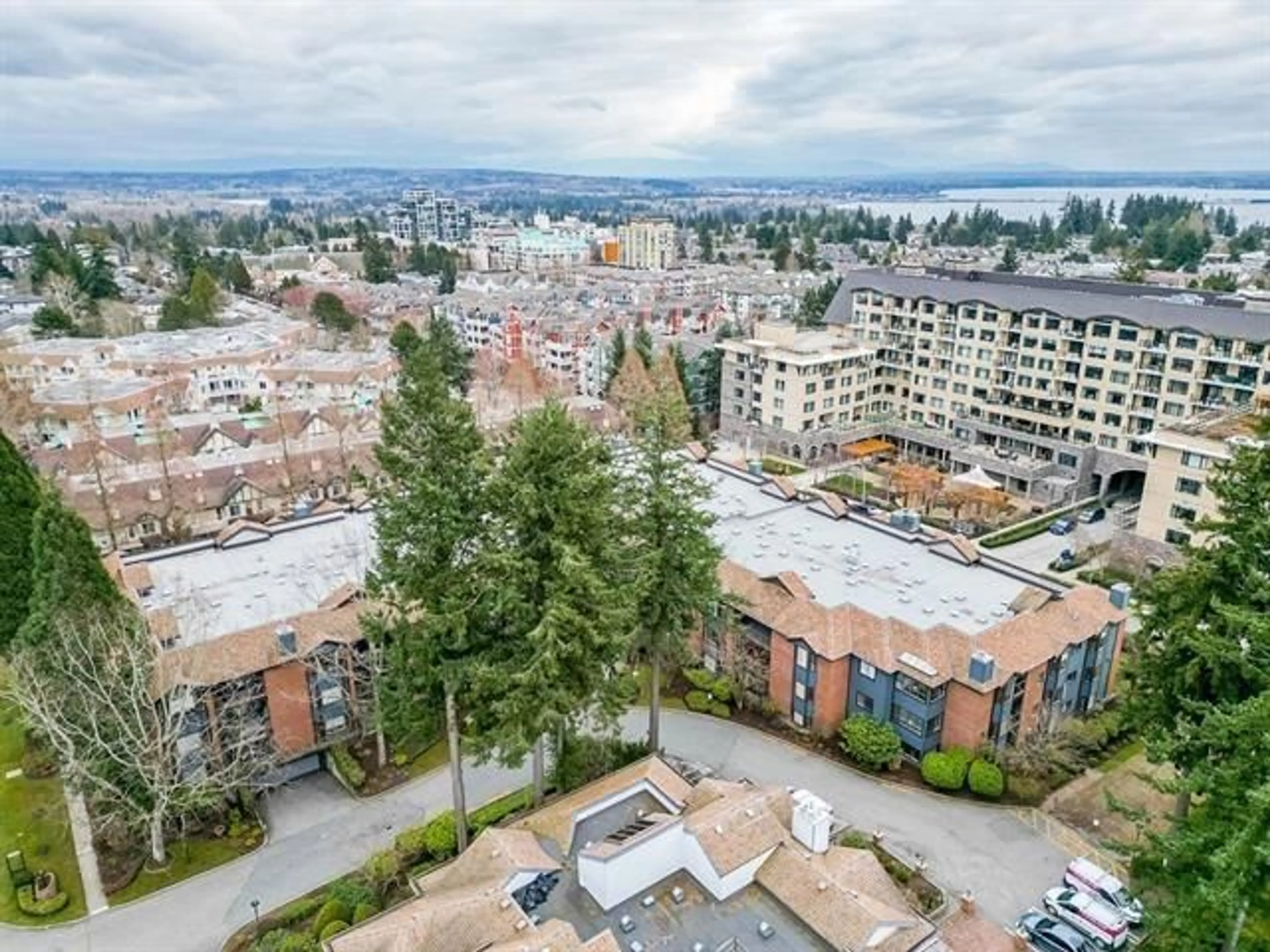 A pic from outside/outdoor area/front of a property/back of a property/a pic from drone, unknown for 107 - 15300 17, Surrey British Columbia V4A8Y6