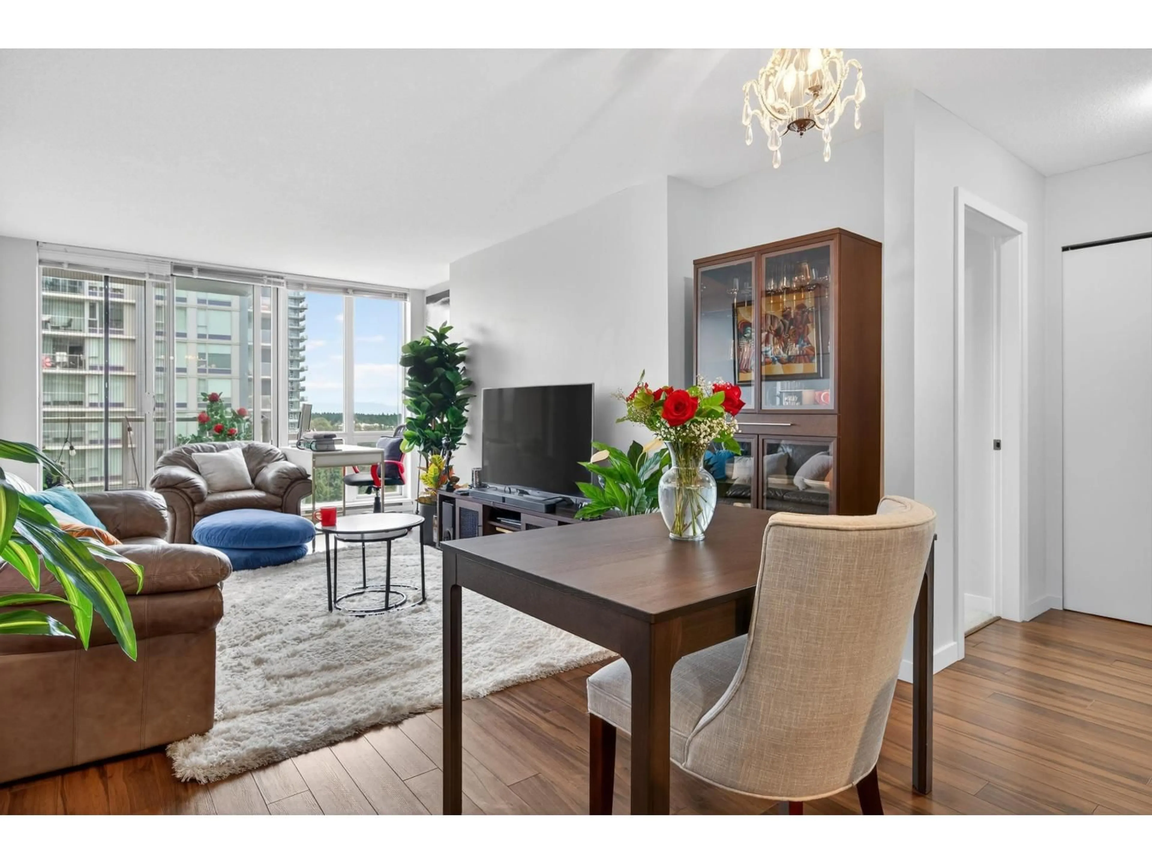 Living room with furniture, wood/laminate floor for 2309 - 13688 100, Surrey British Columbia V3T0G5