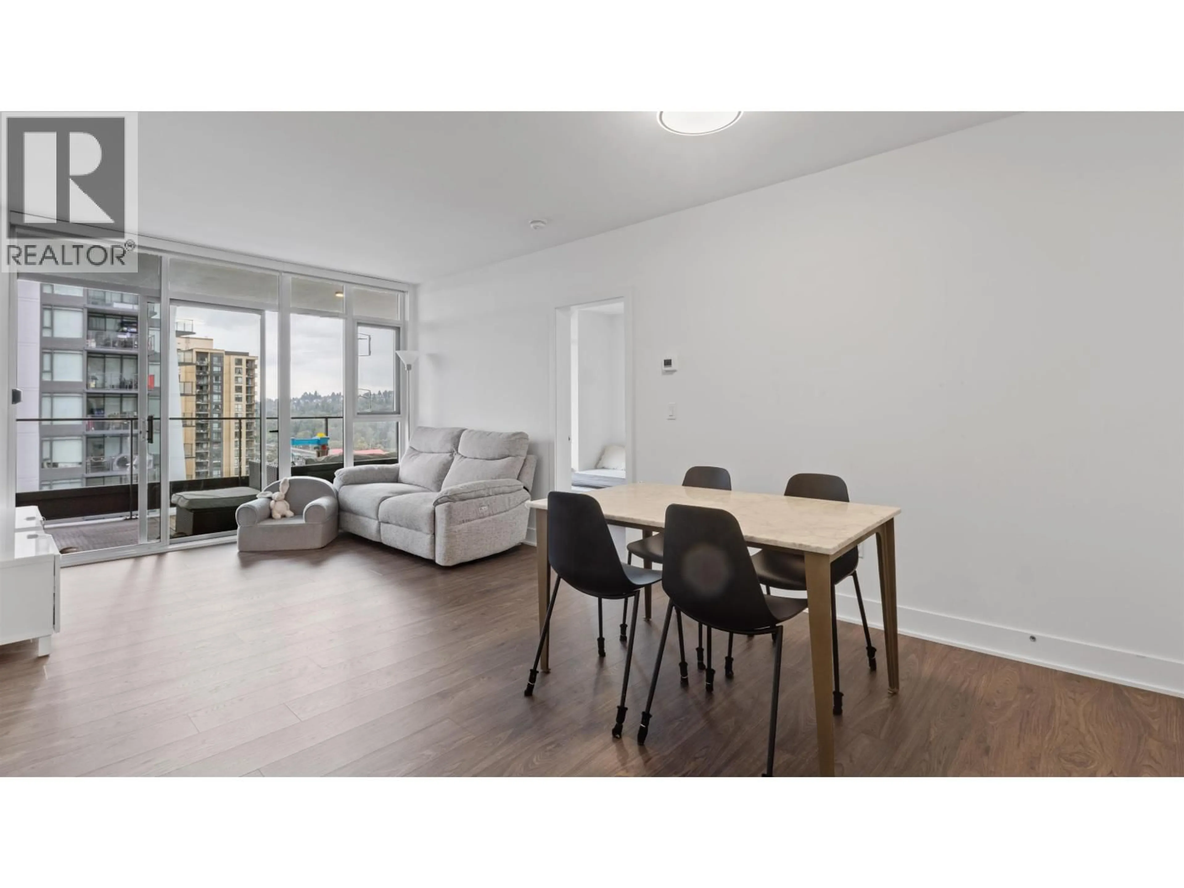Living room with furniture, wood/laminate floor for 707 - 450 WESTVIEW STREET, Coquitlam British Columbia V3K0G3